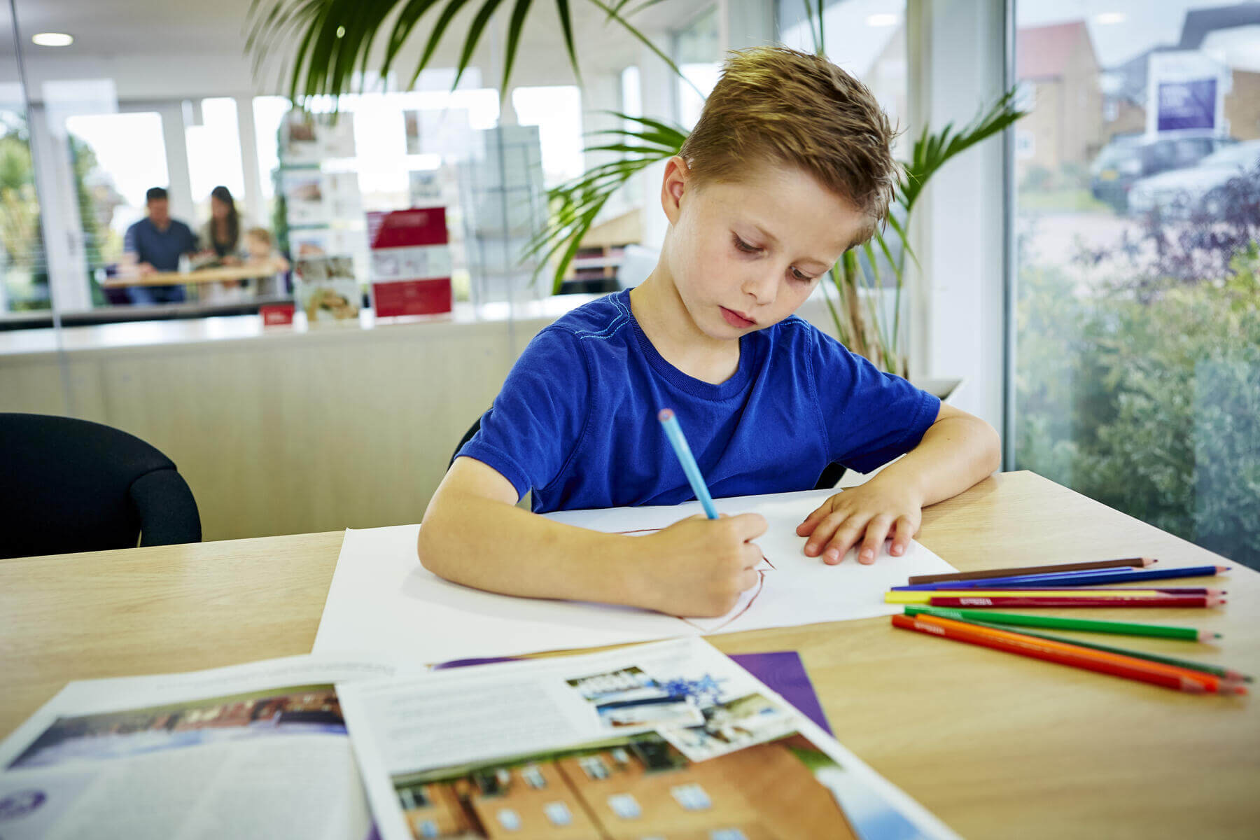 Child drawing in Sales Office