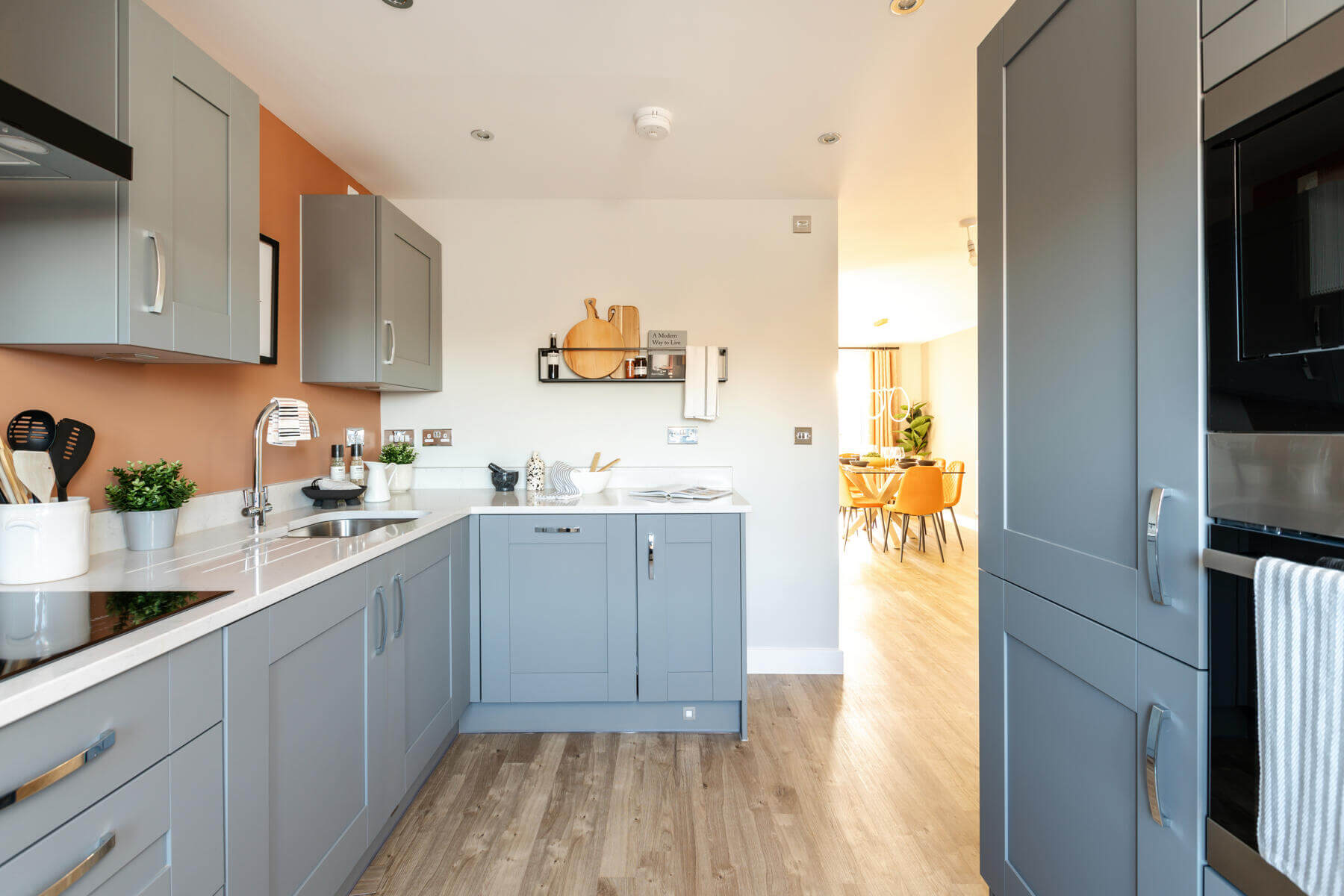 A bright and airy kitchen is at the front of the home