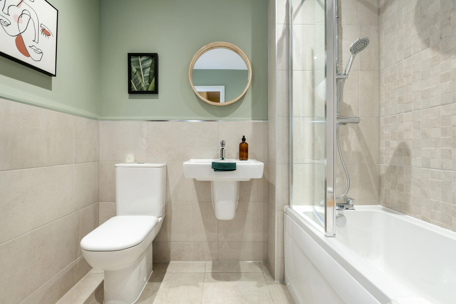 Toilet with a shower over the bath 