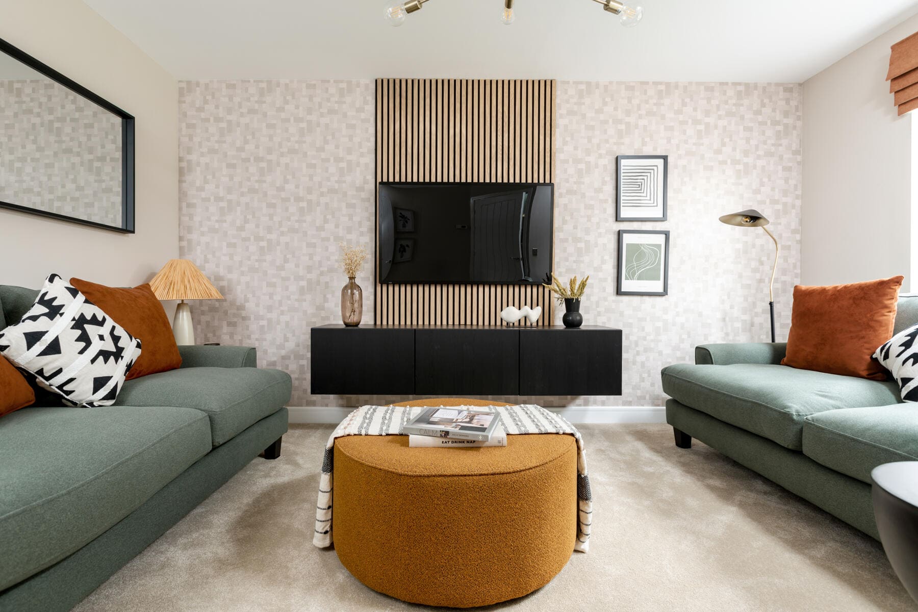 Living room sofa's with tv on the wall 