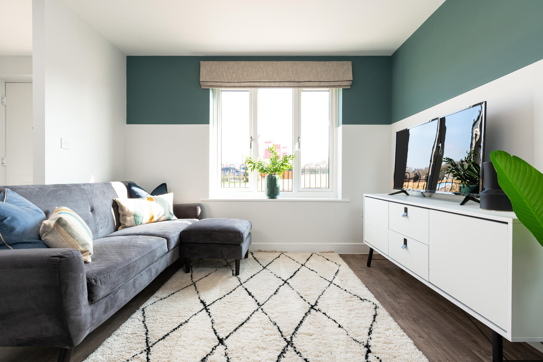 Sofa and TV on sideboard