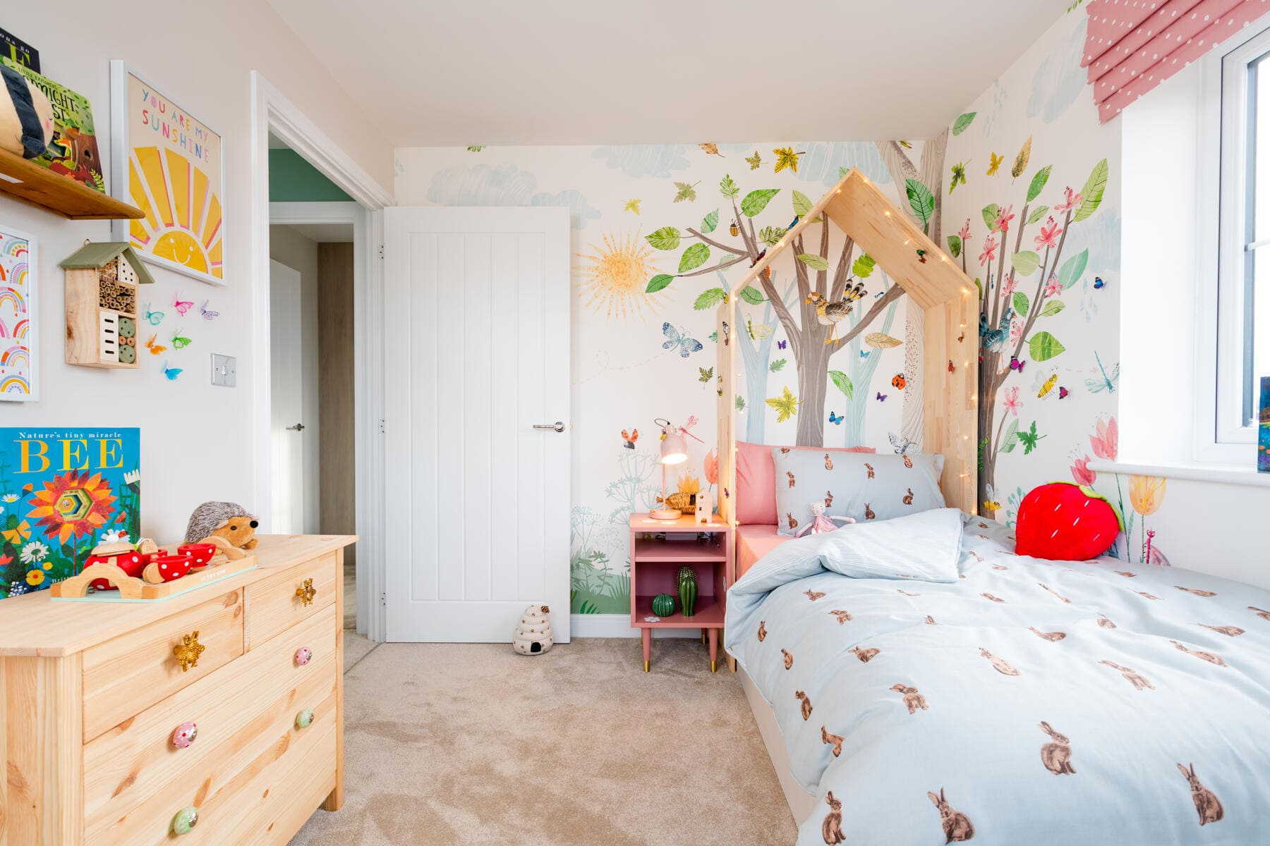 Bed with chest of draws and window