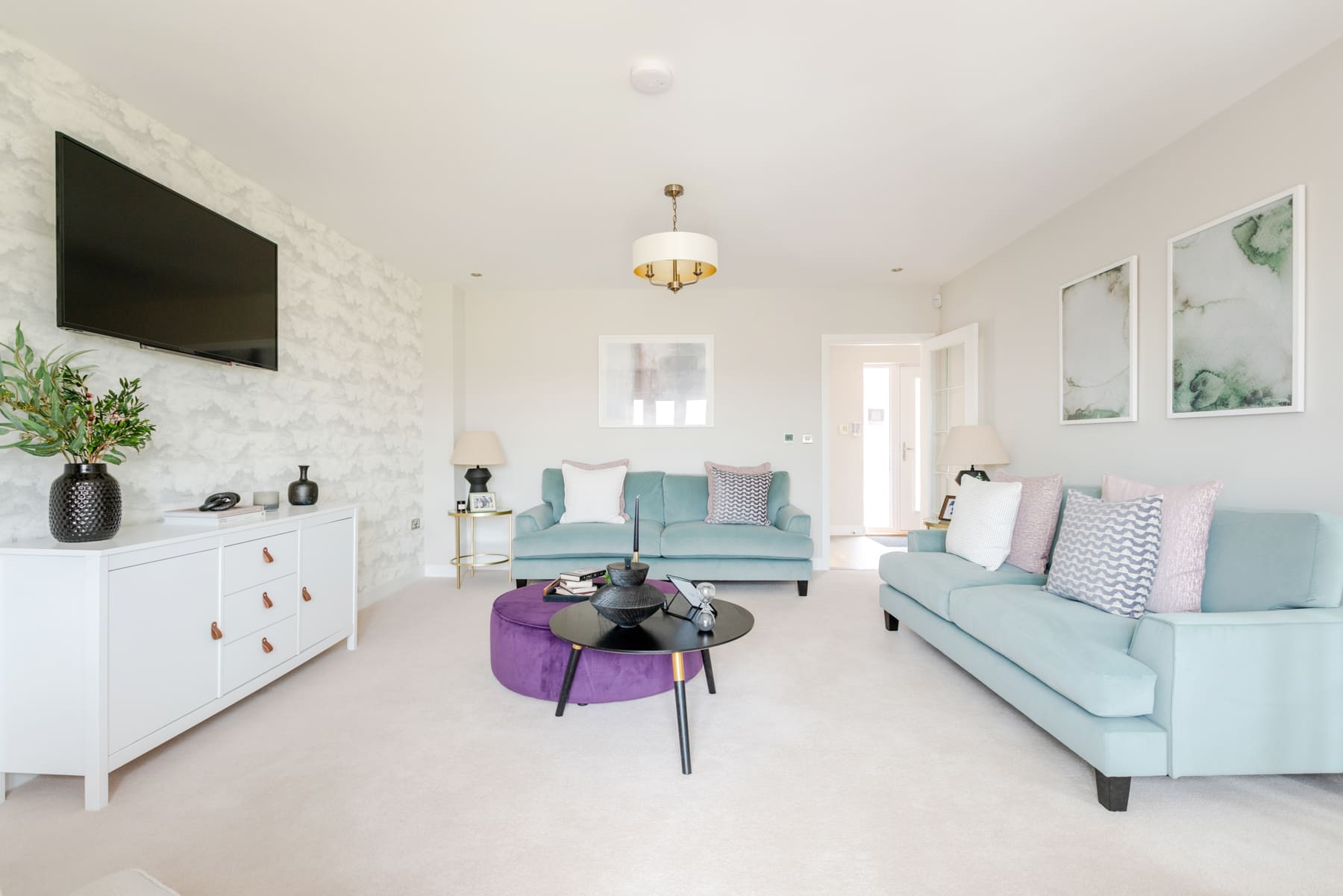 Sofa and coffee table with TV in lounge