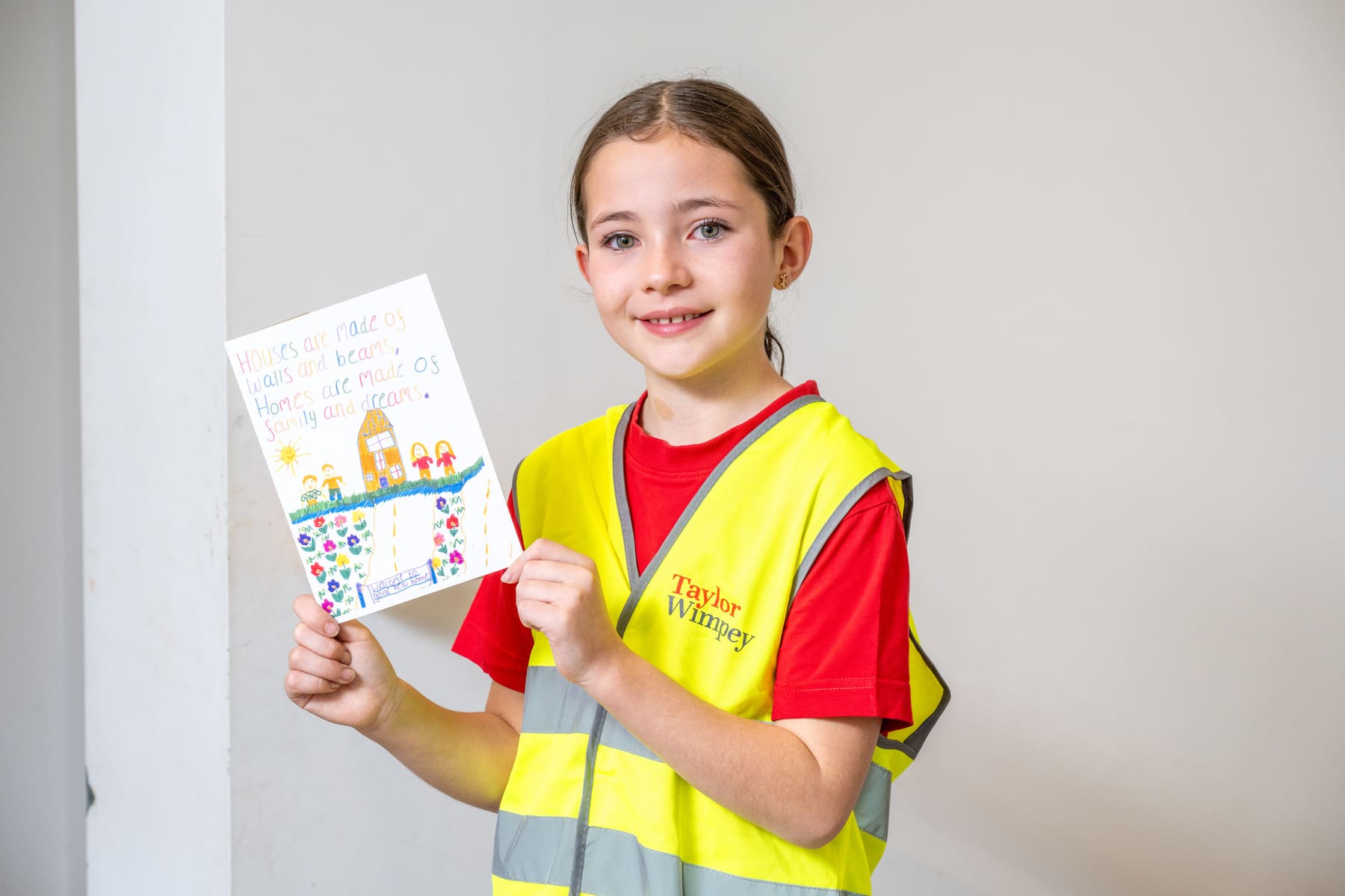 Winning pupil with her card design