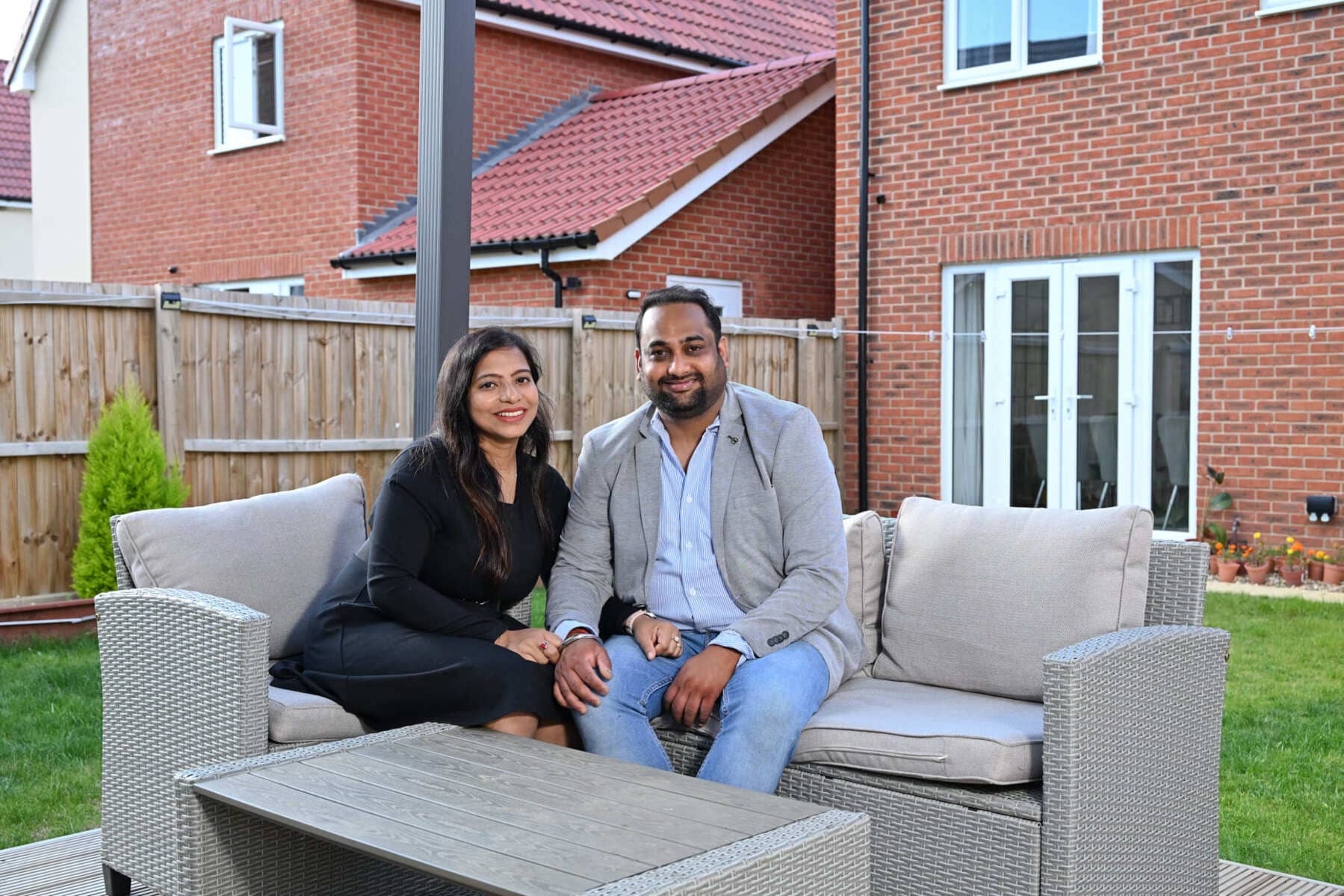 Man and woman sitting outside in the garden