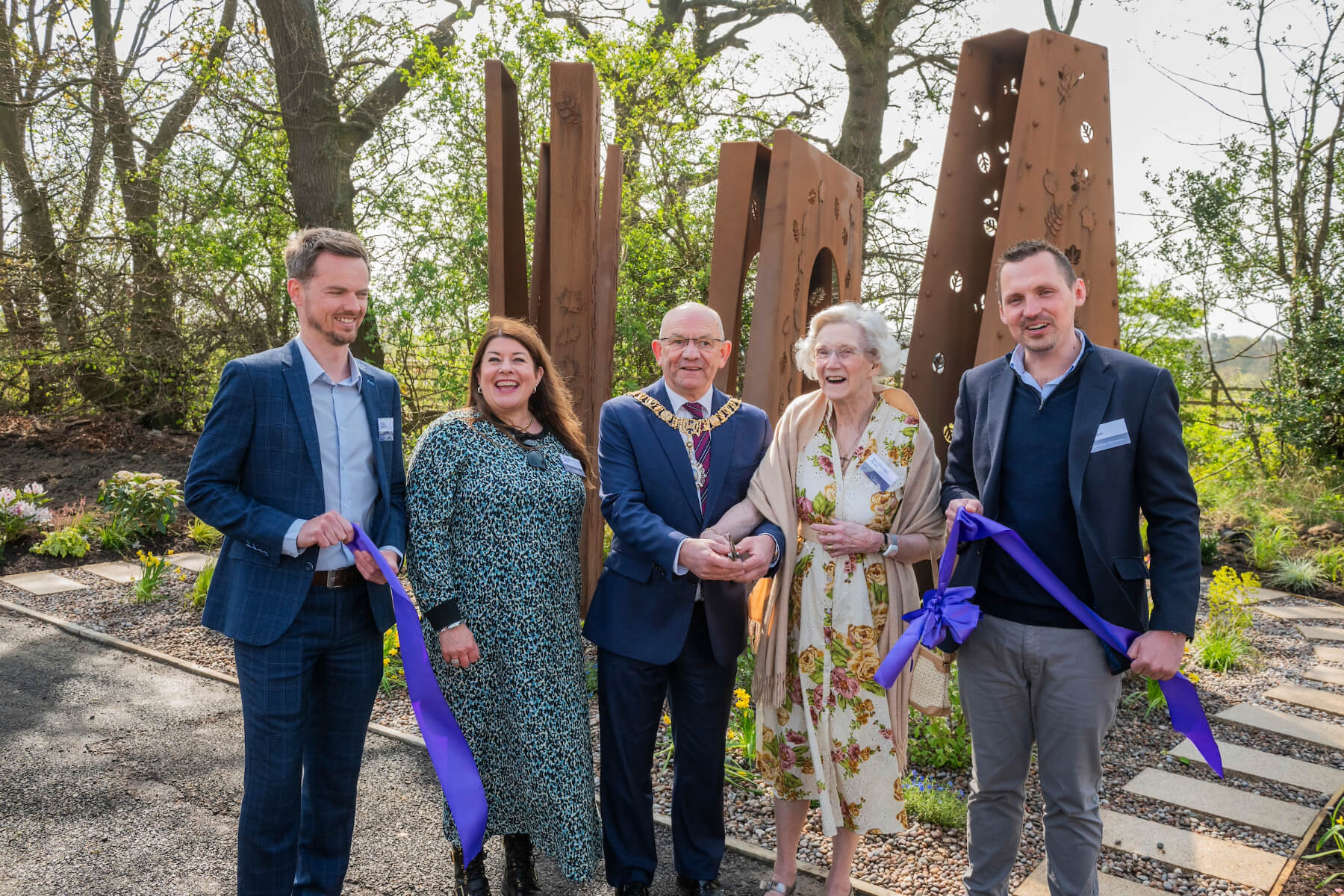 Jordan Howieson (Senior Architectural Technician), Pauline Mills (Technical Director), The Lord Provost Robert Aldridge, Mrs Elizabeth Grubb, and Phil Cooper (Land and Planning Director) at the opening of the new public artwork at Hawthorn Gardens.