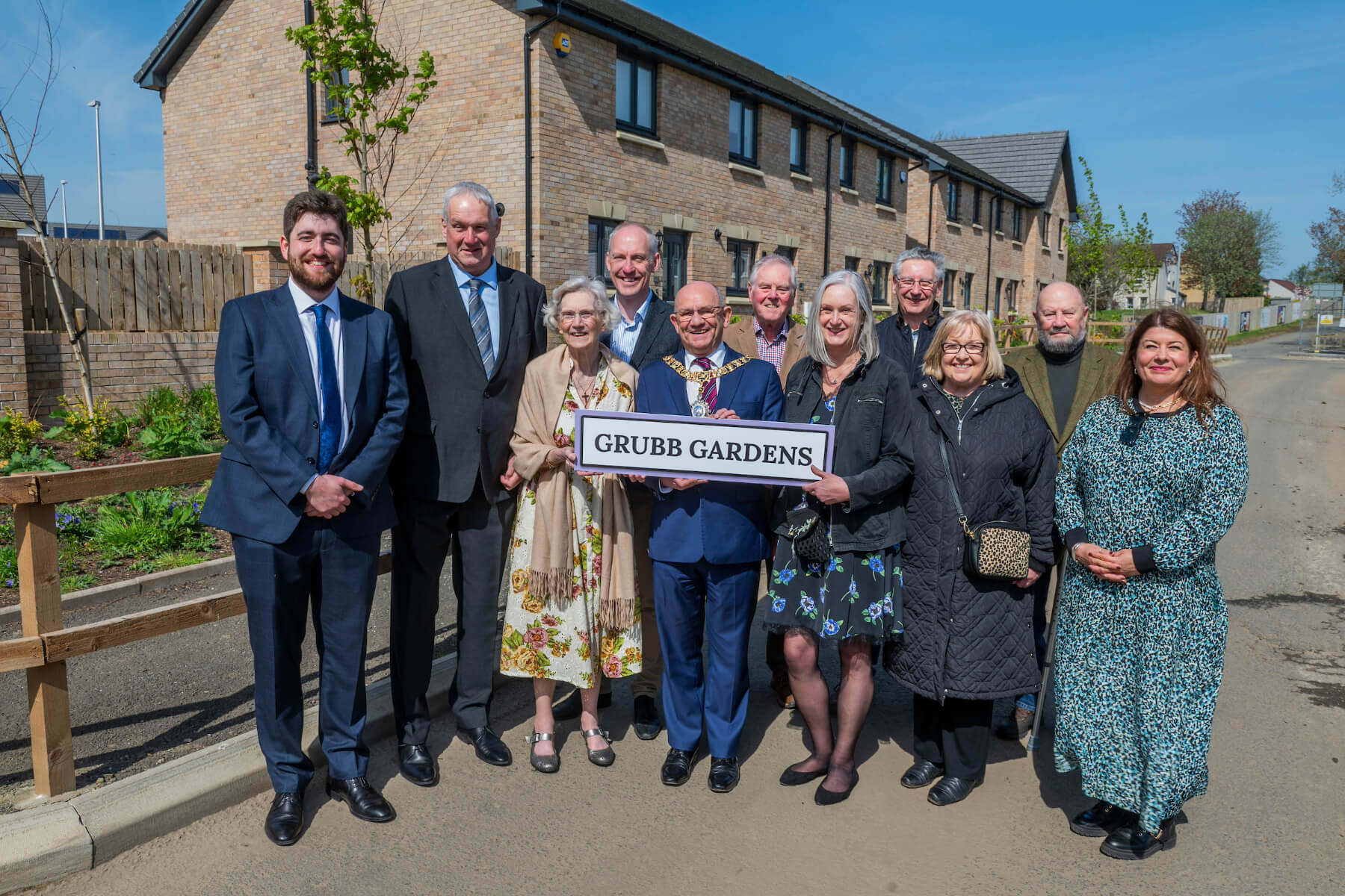 The Lord Provost, Robert Aldridge, with Mrs Elizabeth Grubb, her son Rhoderick and daughter Mhairi, with representatives of QDCC and Local Councillors along with Pauline Mills, Technical Director for Taylor Wimpey East Scotland.