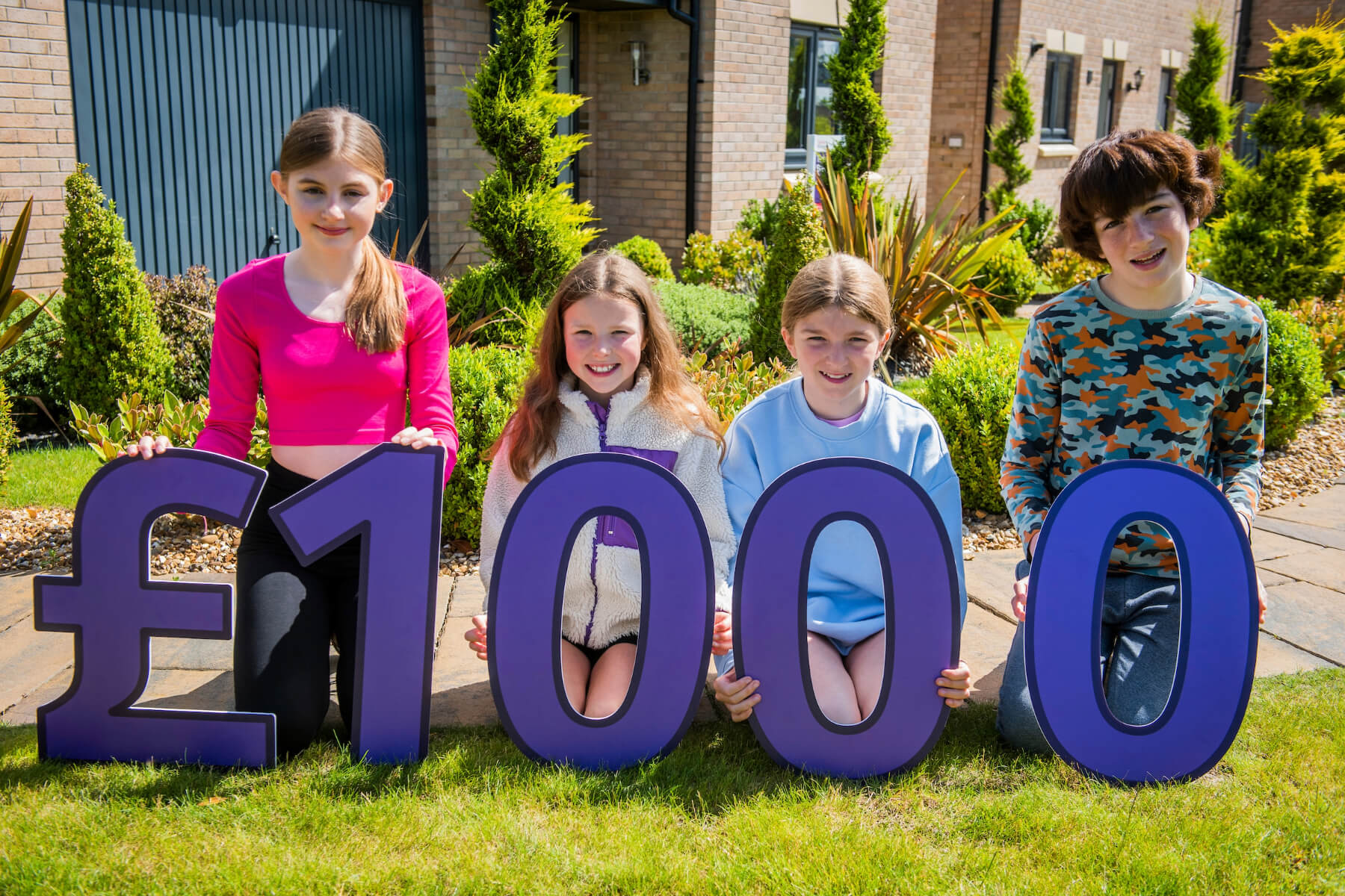 Representatives from Queensferry Community Association, City of Edinburgh Council Lifelong Learning Services, Queensferry & District Community Council join local Taylor Wimpey East Scotland sales executive Helen Allenby at Hawthorn Gardens in South Queensferry.  They are also joined by some of the young people hoping to take part in the Summer Fun Programme.