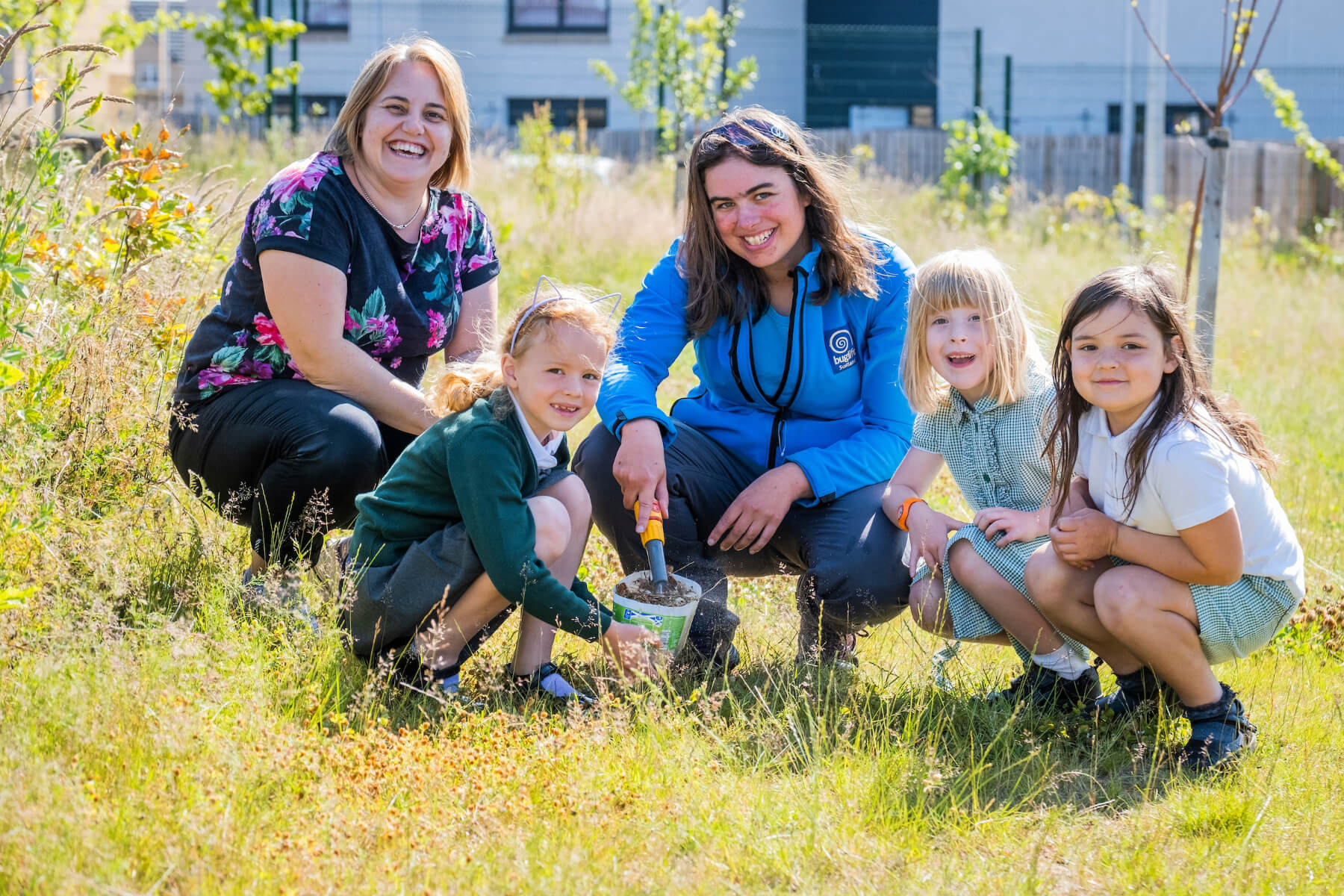 Karen Malt, Taylor Wimpey East Scotland’s local sustainability champion with Melissa Shaw, Buglife Conservation Officer and children from Letham Mains Primary School