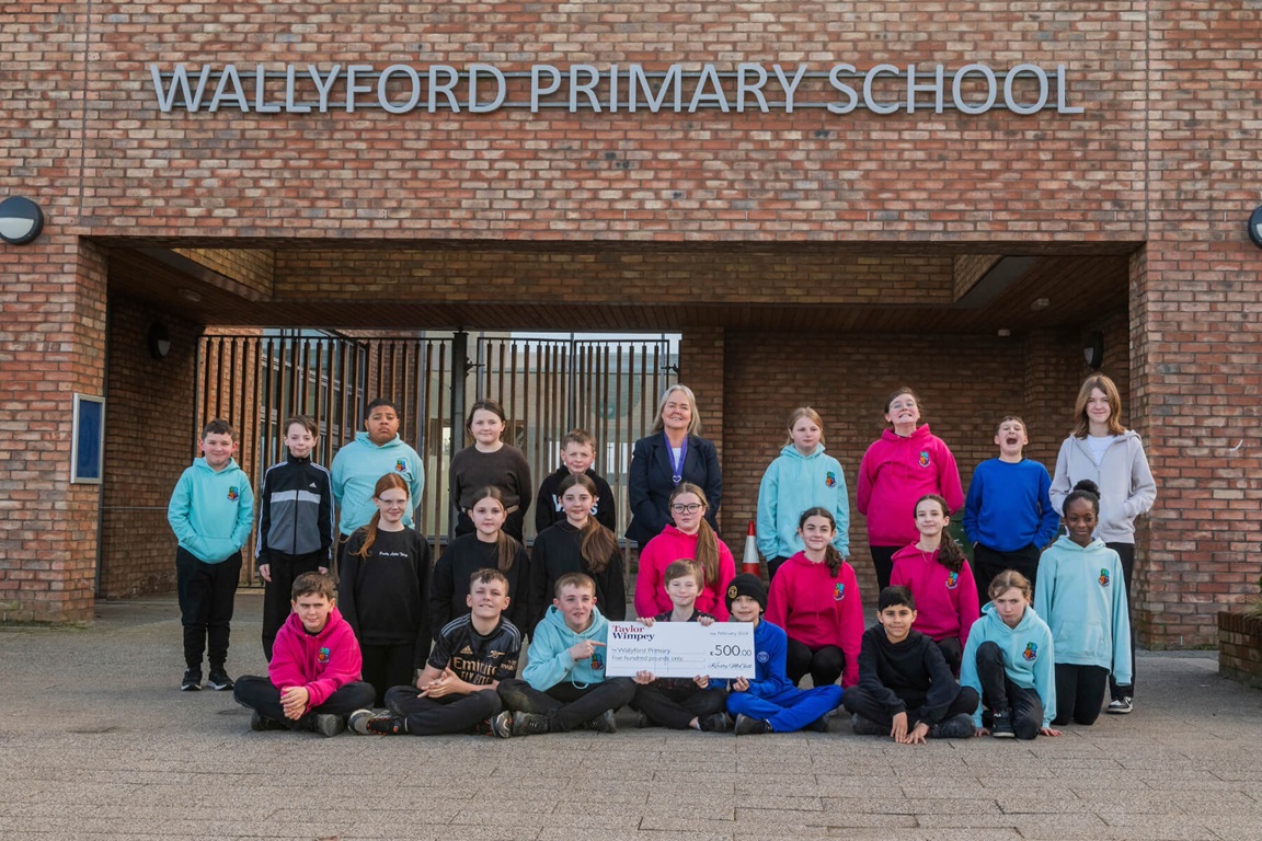 Taylor Wimpey’s sales executive Donna Koch based at Taylor Wimpey’s Ravensheugh development at St Clements Wells in Wallyford, with Primary 7 at Wallyford Primary.