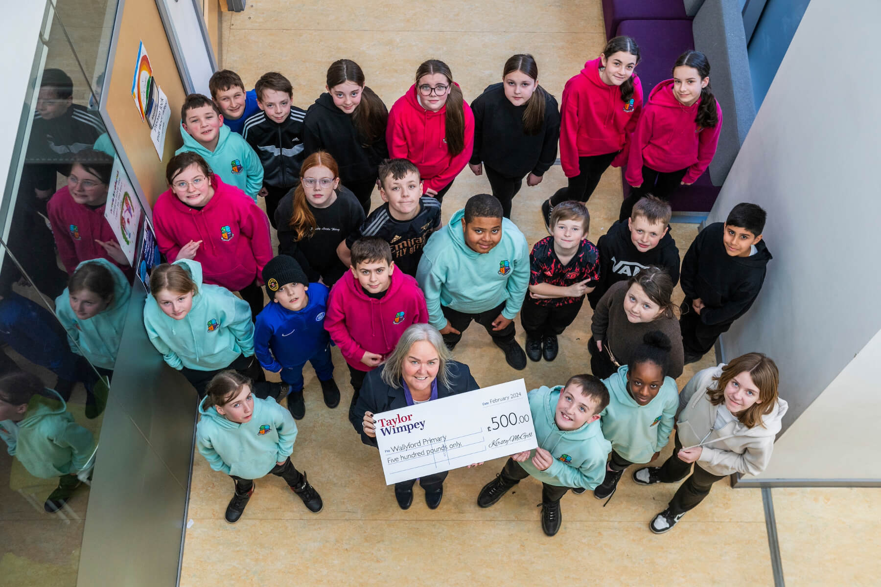 Taylor Wimpey’s sales executive Donna Koch based at Taylor Wimpey’s Ravensheugh development at St Clements Wells in Wallyford, with Primary 7 at Wallyford Primary.
