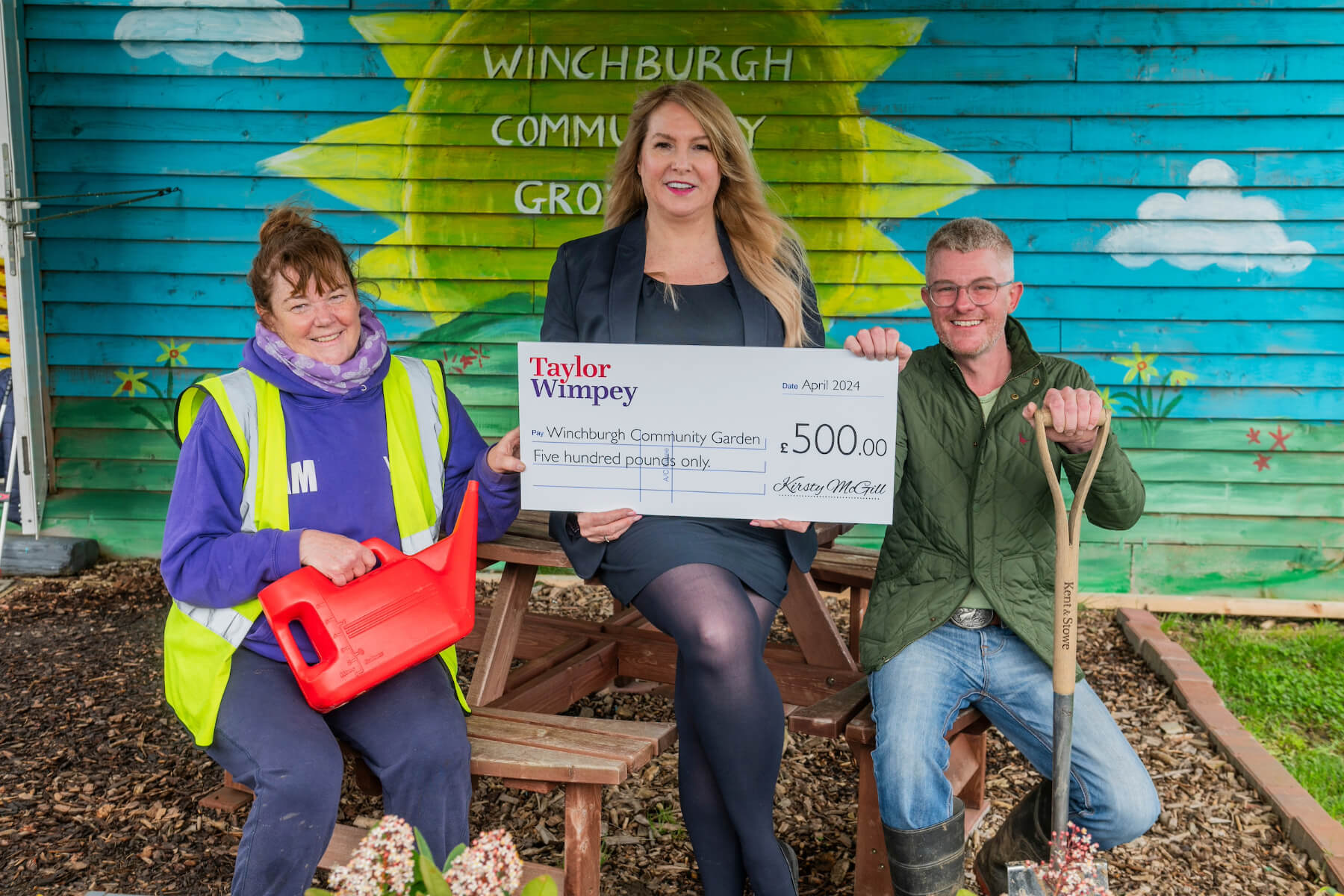 Winchburgh Community Growing Group volunteer – and Head Winchburgh Womble, Aileen Murdoch) and John West (Chairman & co-founder) - with local Taylor Wimpey sales executive Isla Lucey. 
