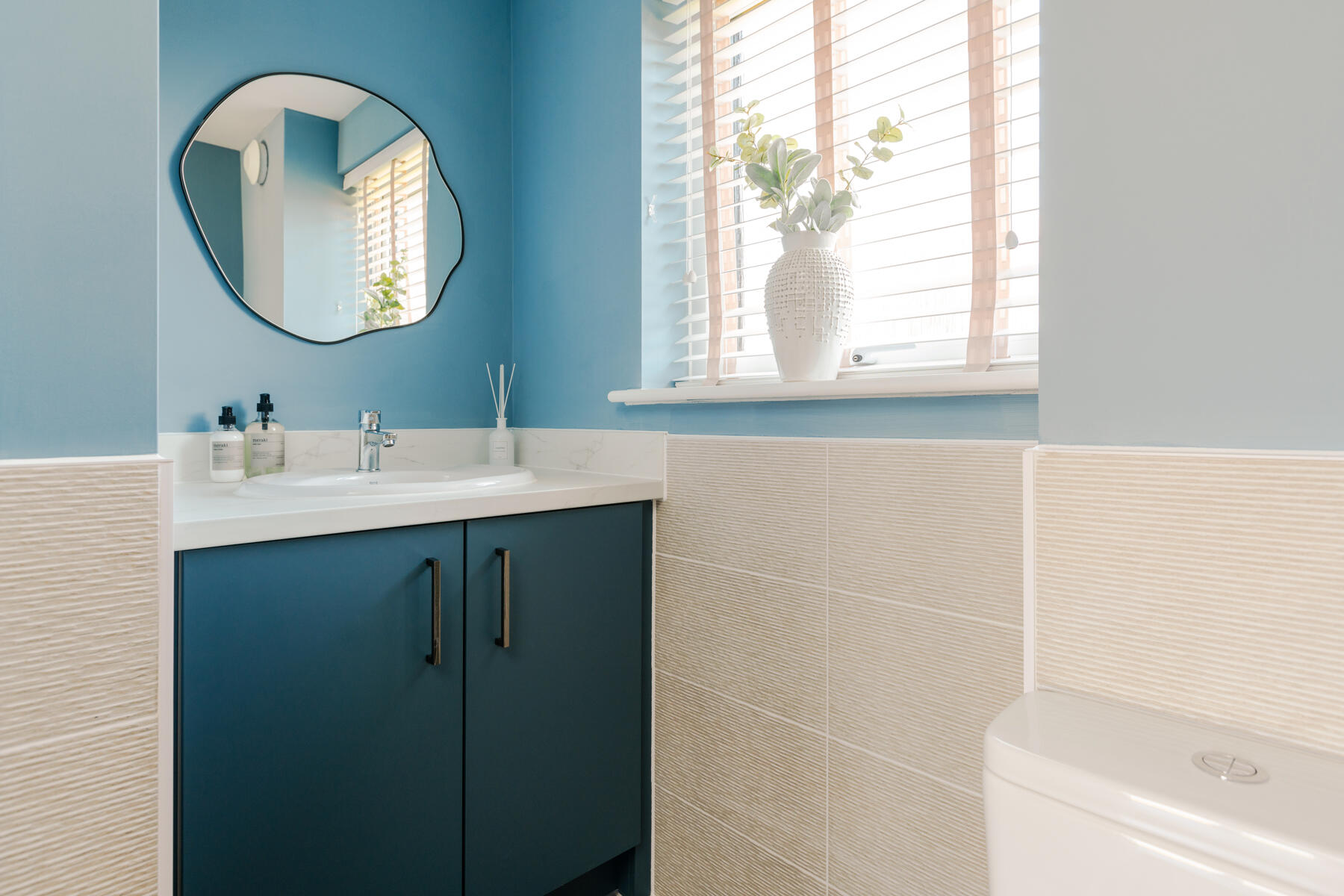 A handy guest cloakroom completes the ground floor