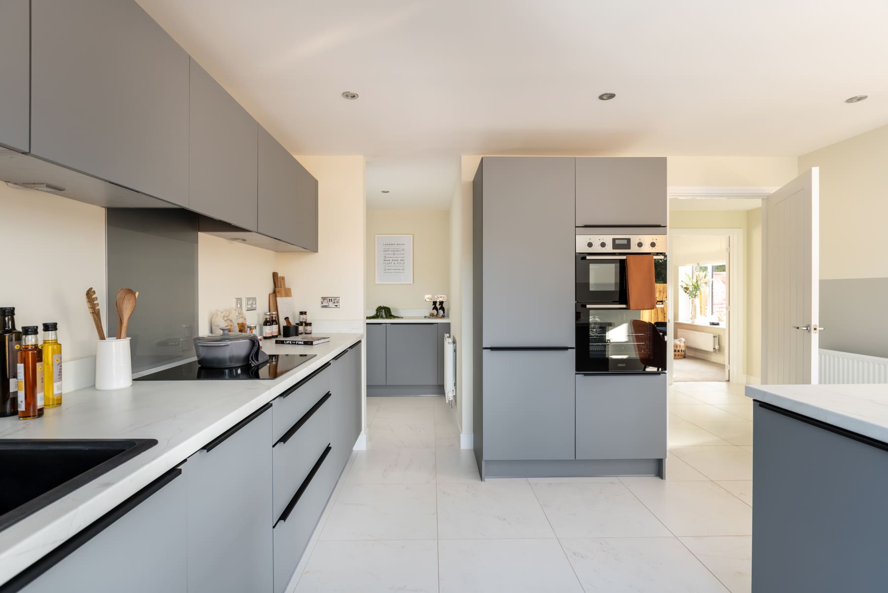 Kitchen with a view of the utility room