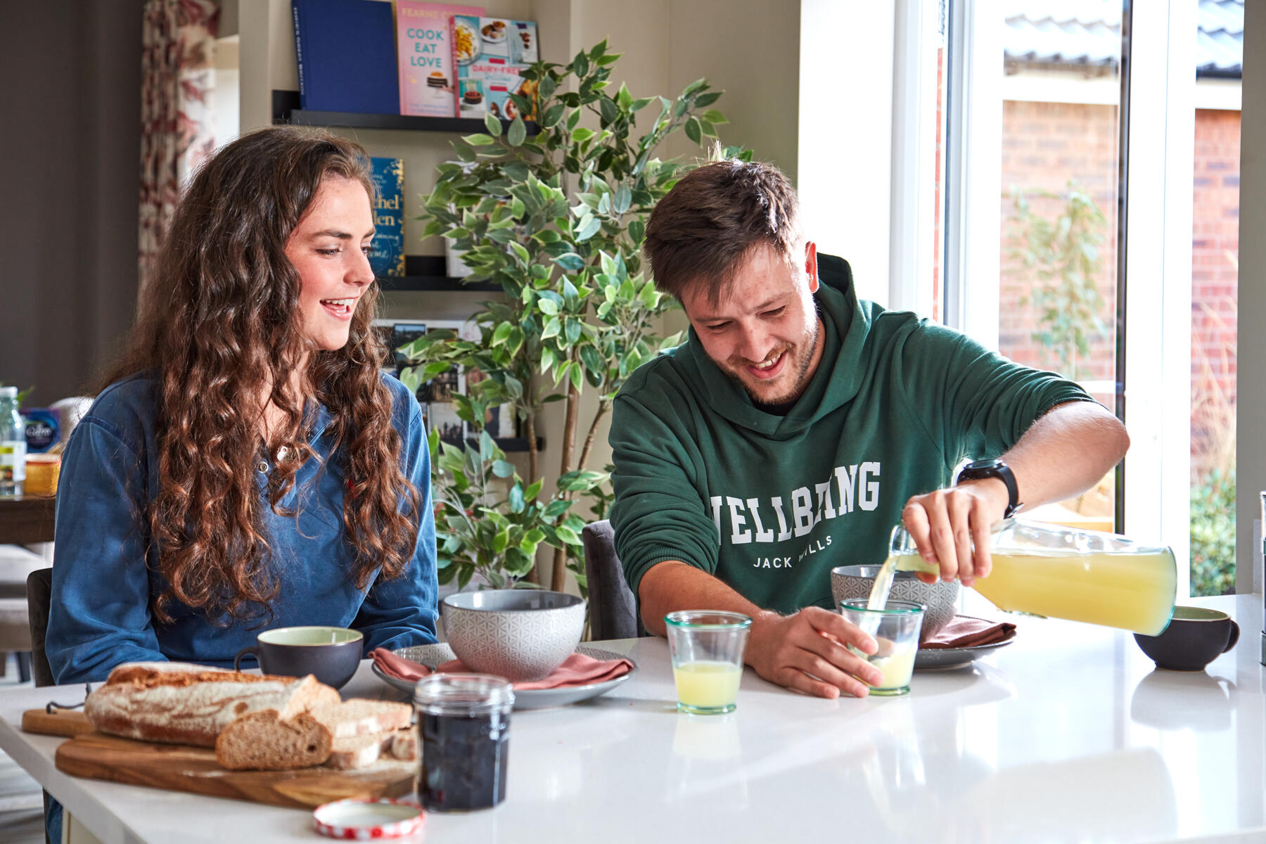 Couple having breakfast in the kitchen