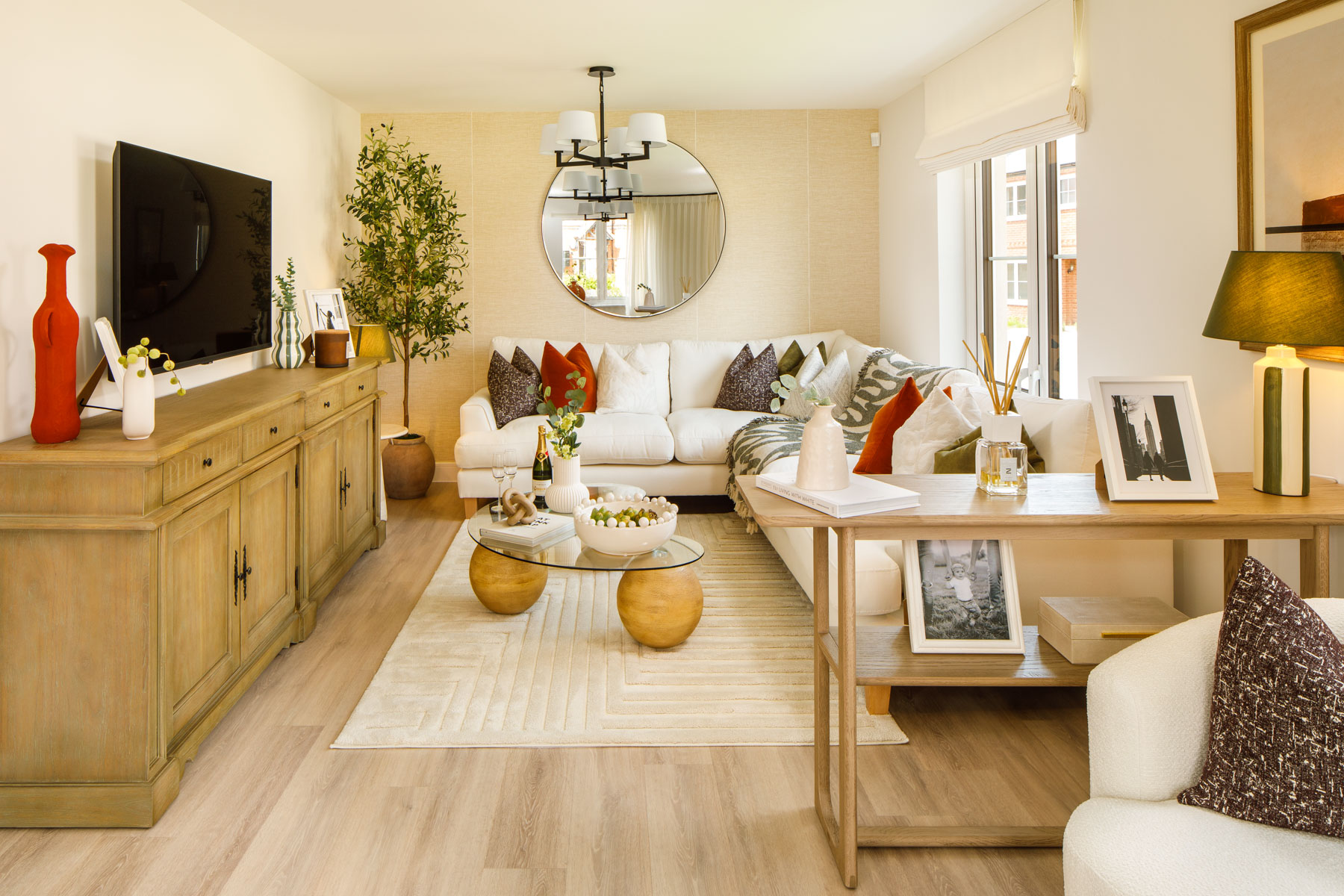 The large living room is spacious and features  double aspect windows