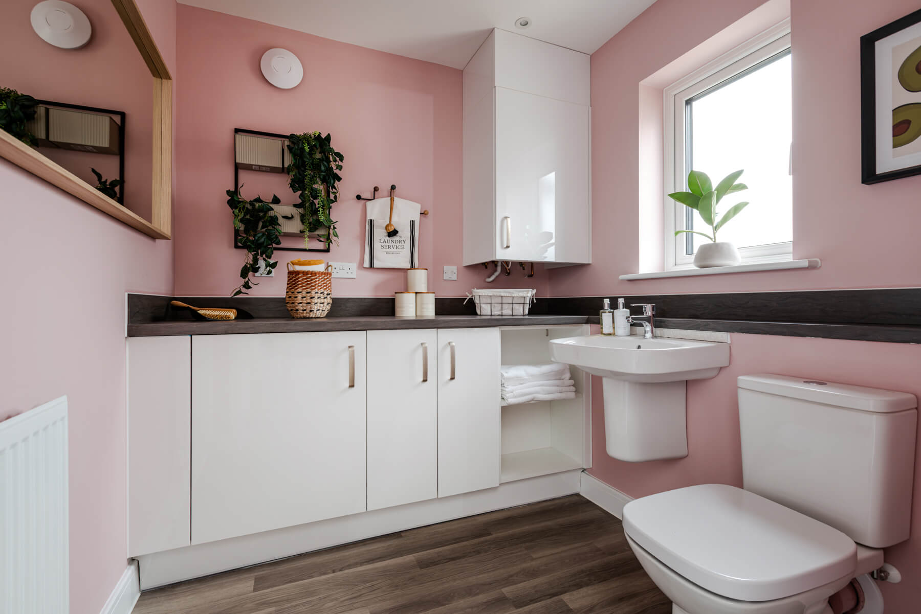 The handy utility room offers plenty of storage and a downstairs toilet