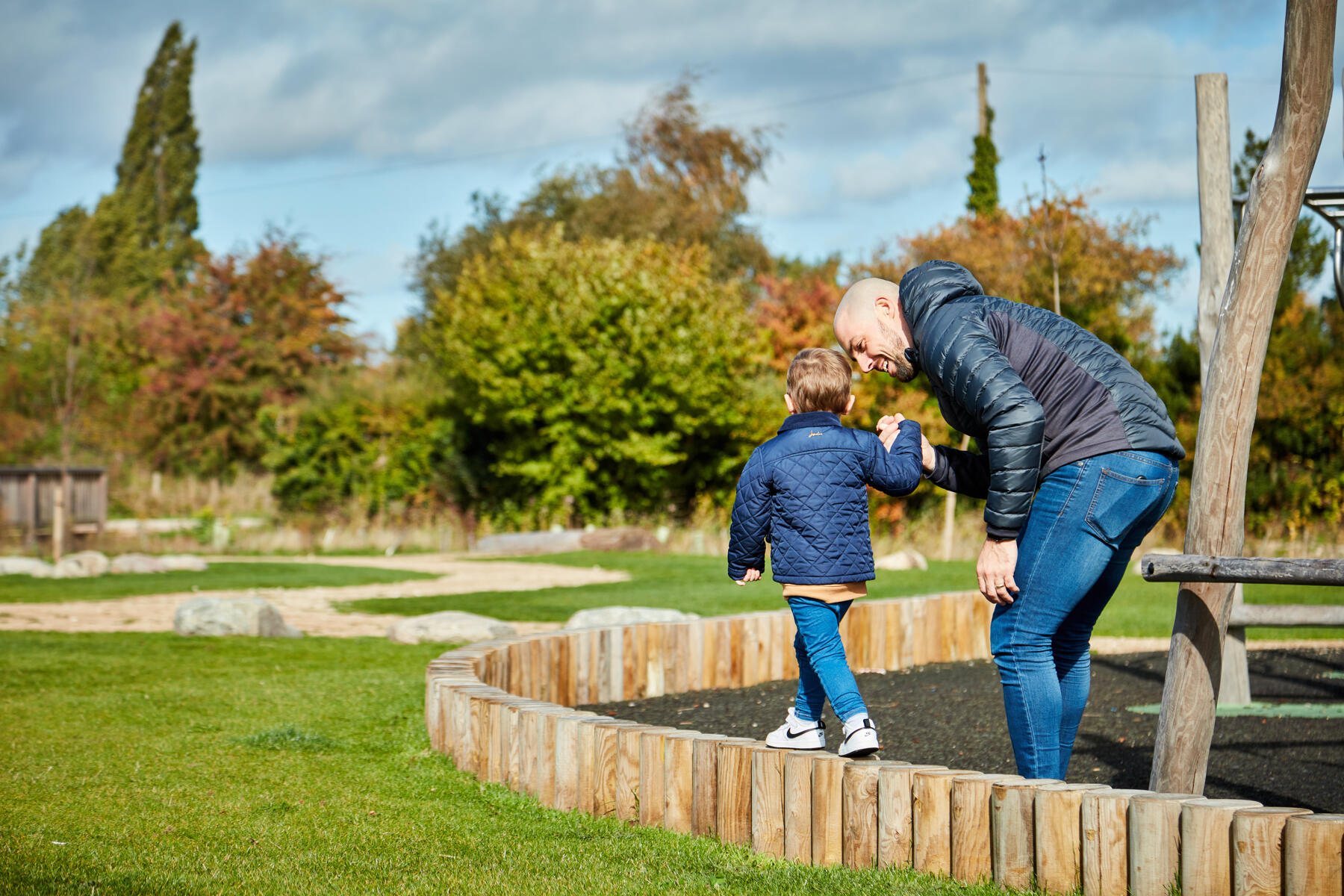 father and child in play area