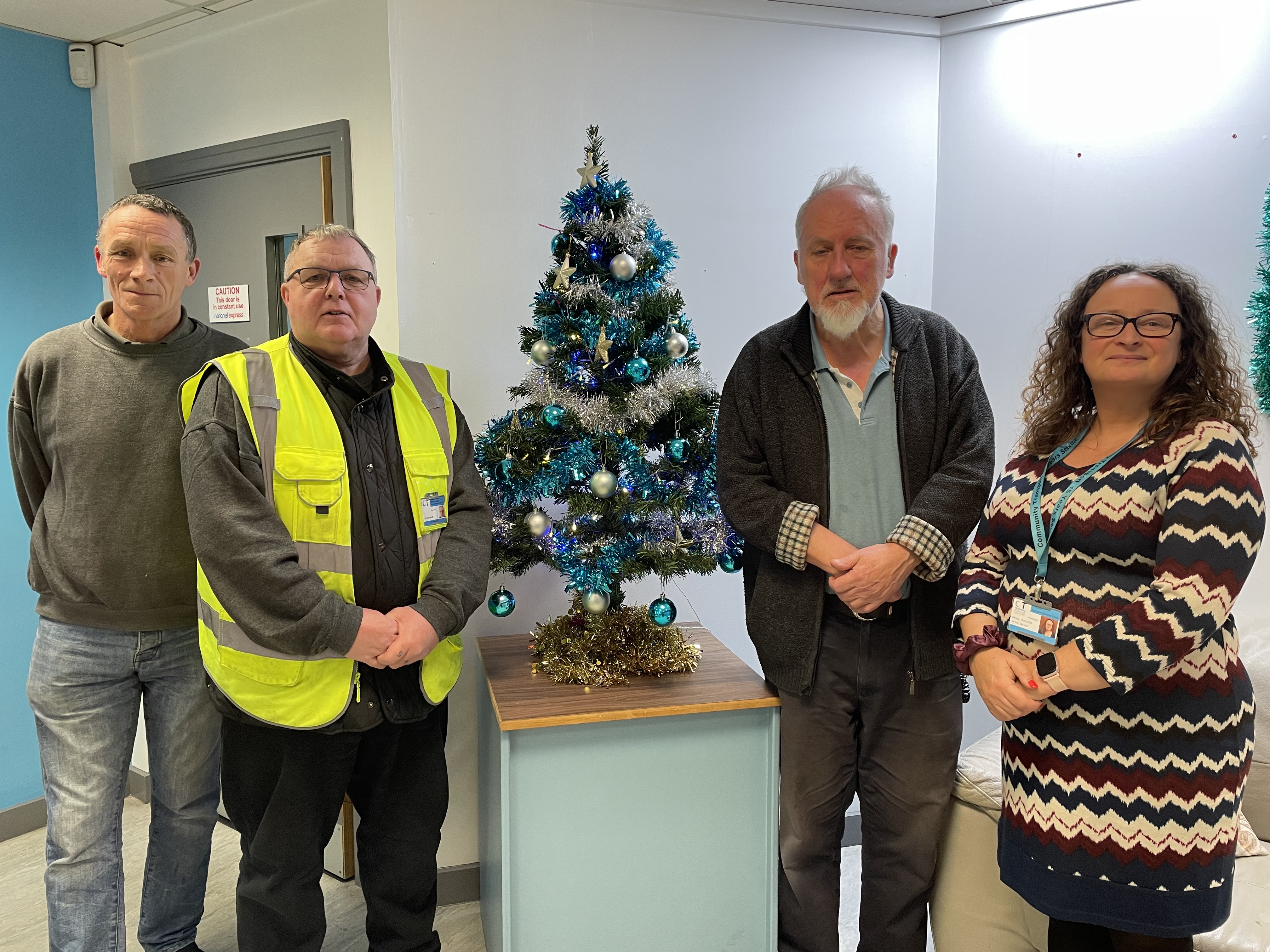 Team around a Christmas tree