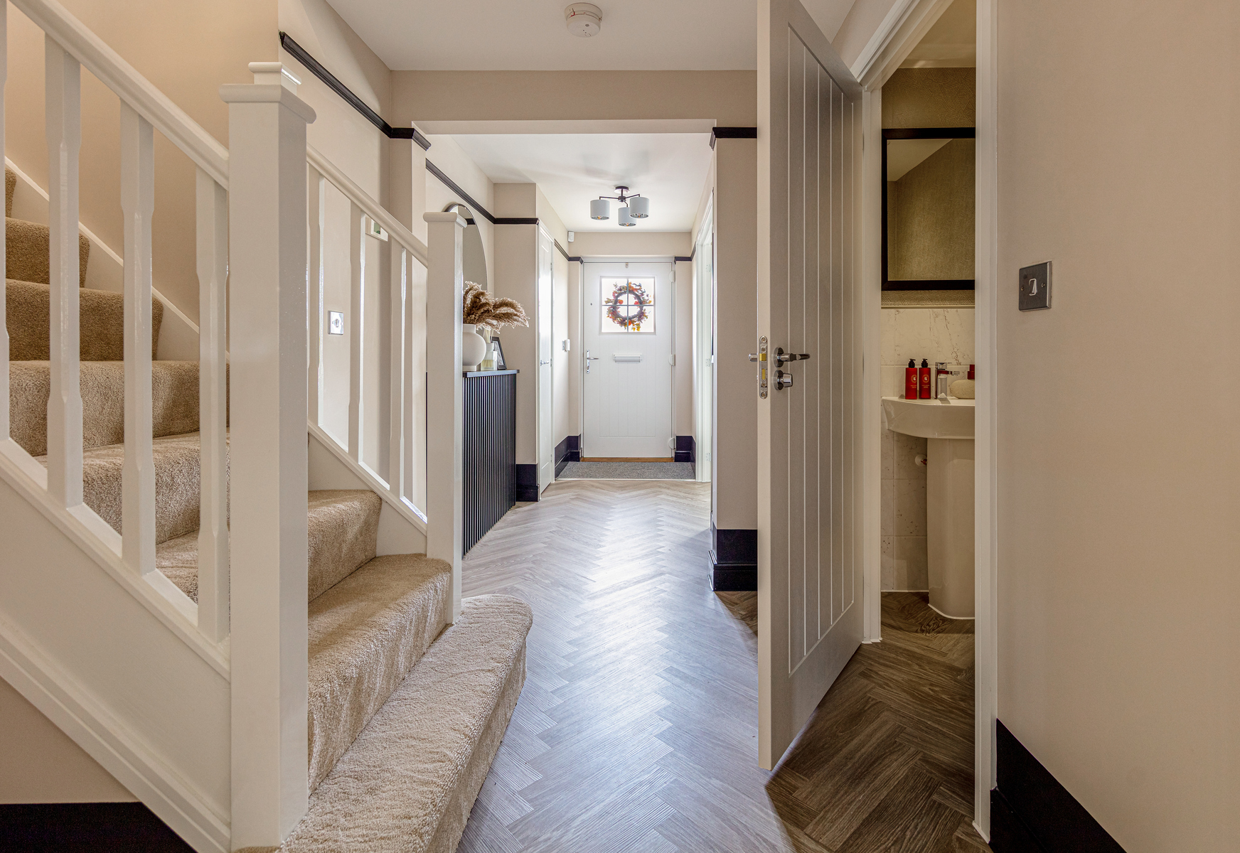 The entrance hall is welcoming with a downstairs WC
