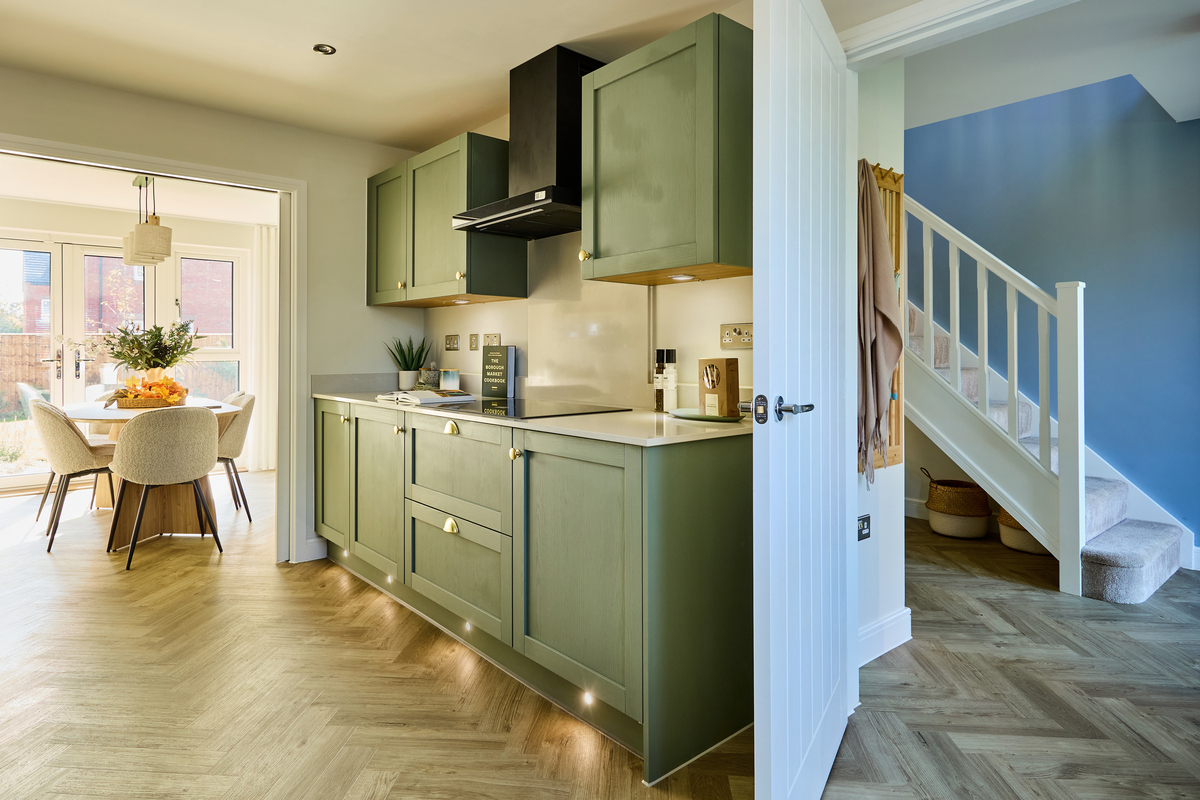 The modern kitchen is light and has ample storage and worktop space