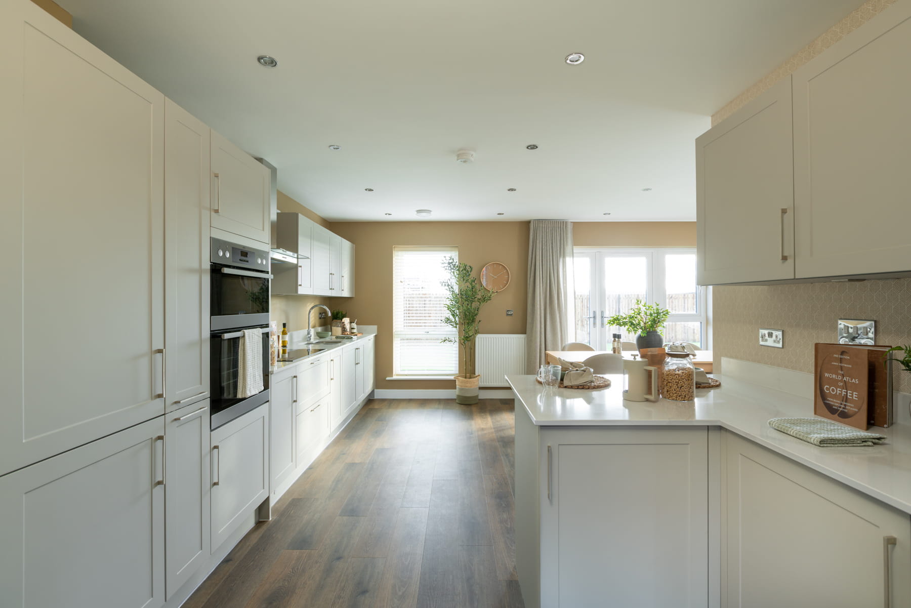 A modern kitchen area with ample storage