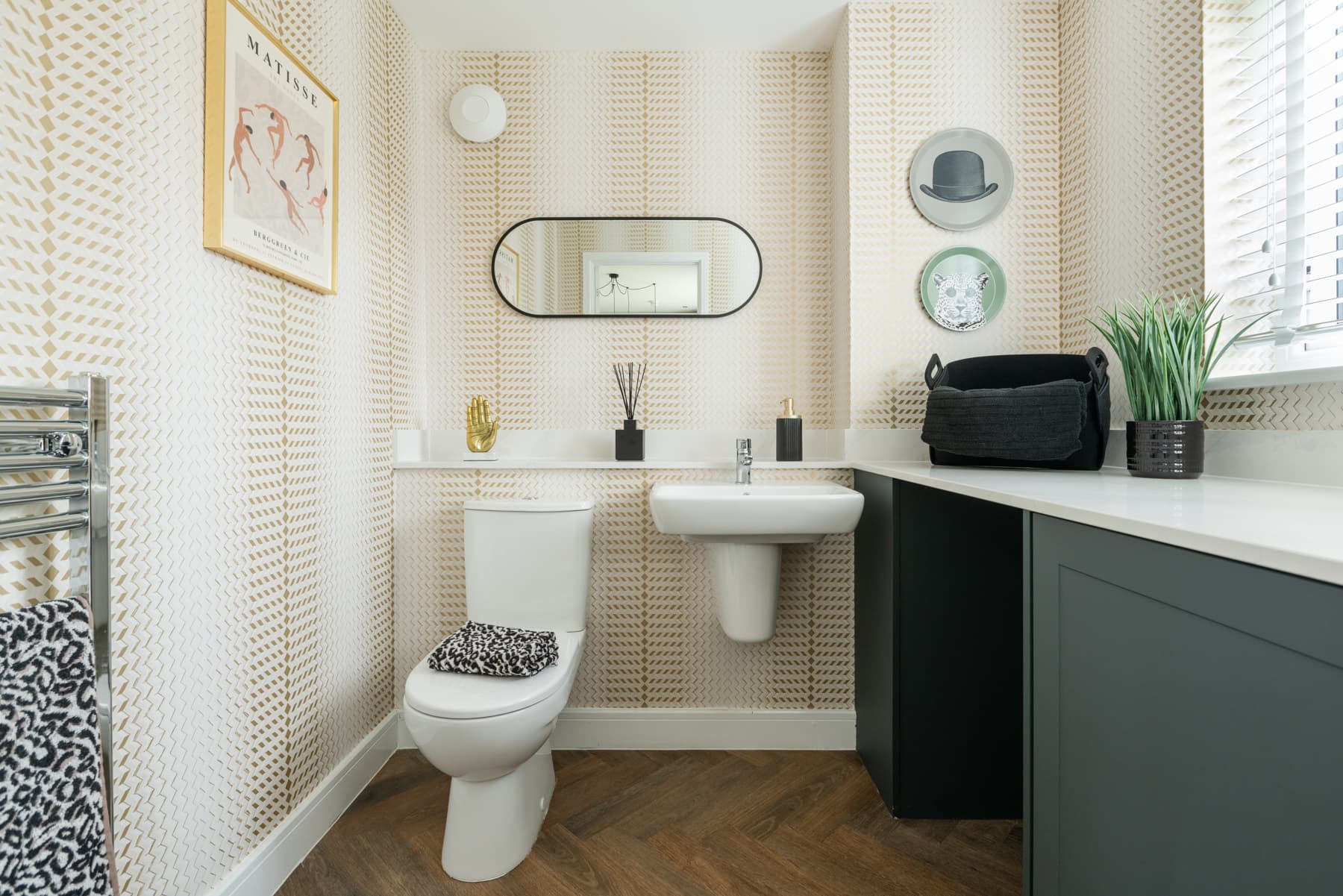 A combined cloakroom and utility adds convenience