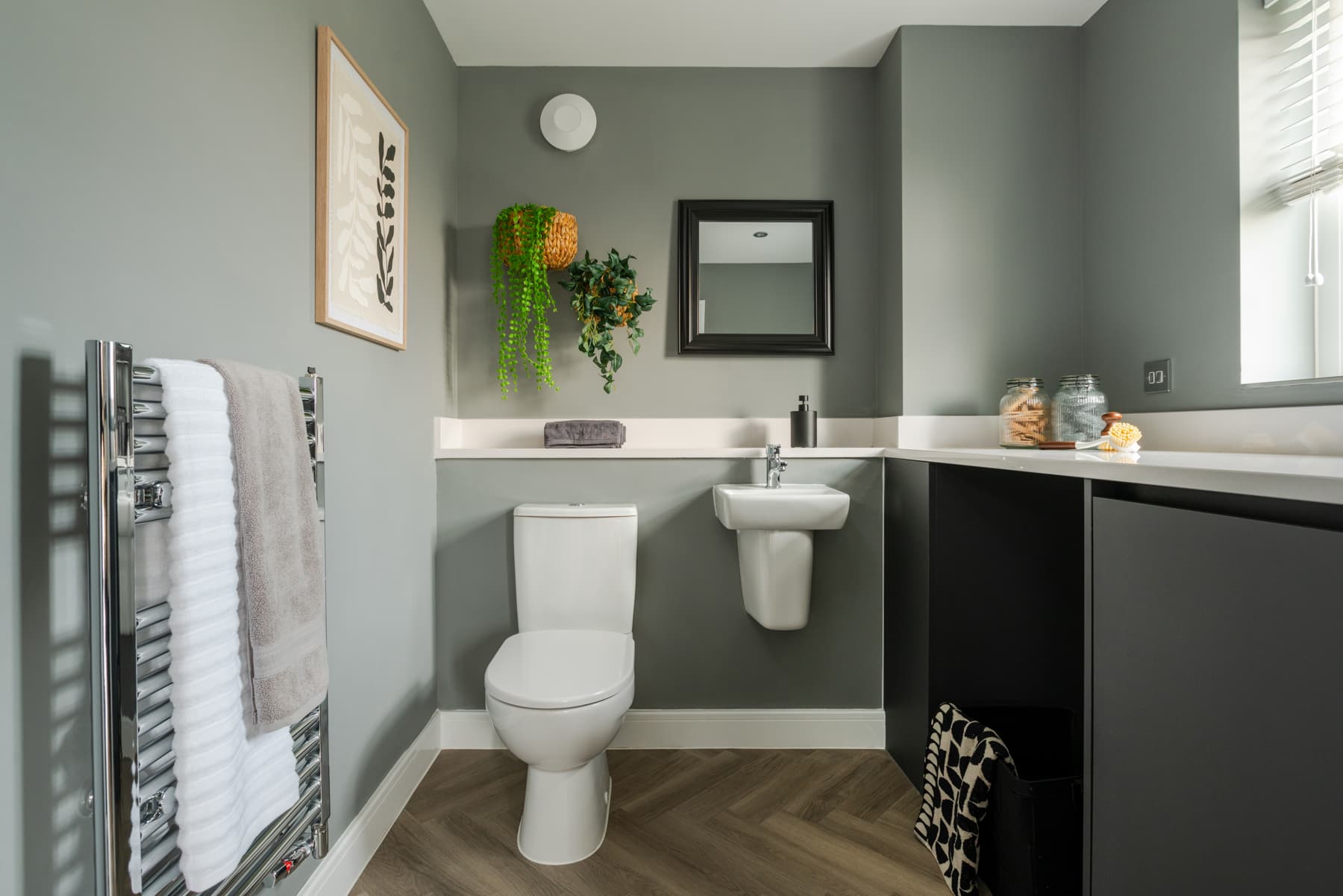 A combined cloakroom and utility adds convenience