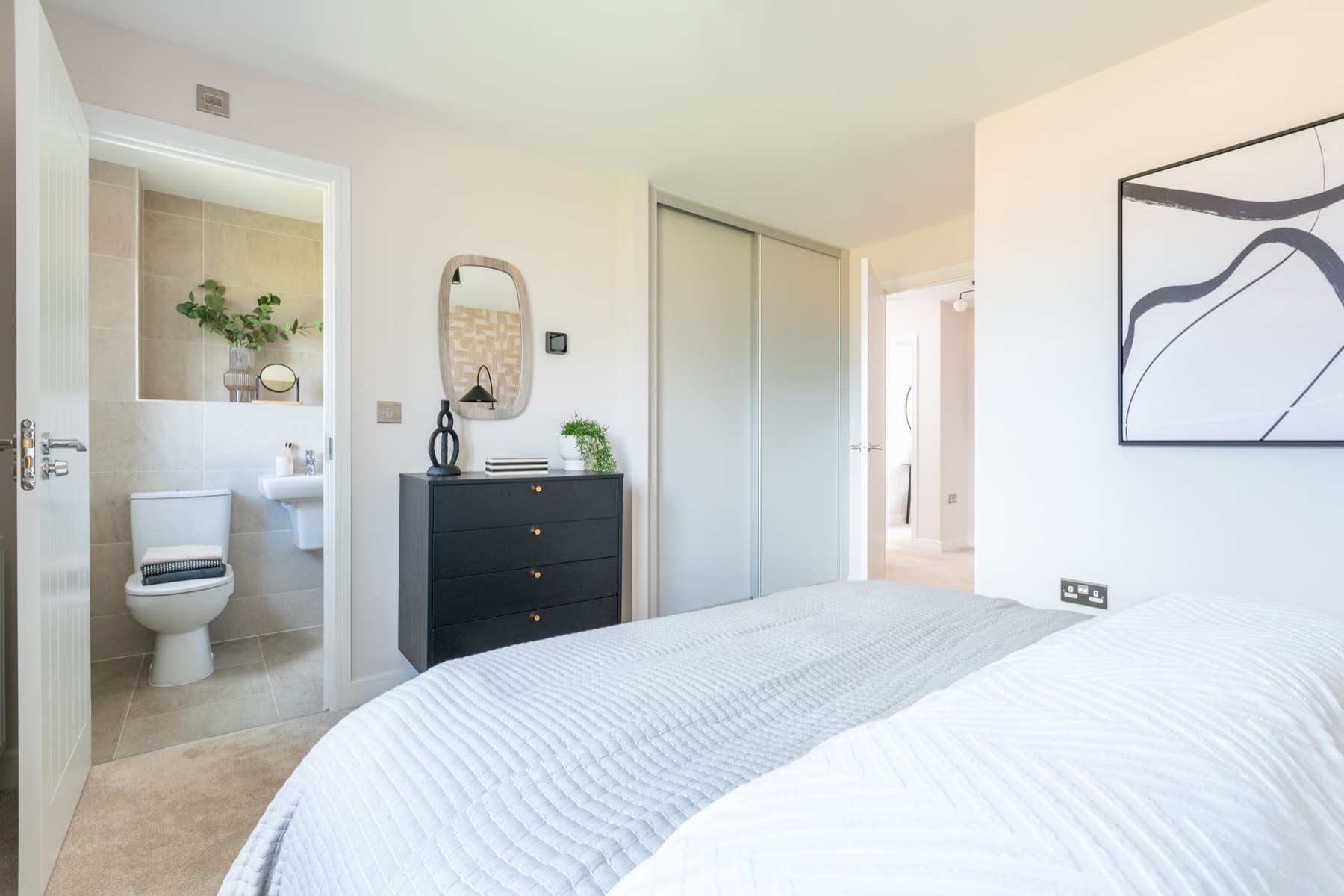 Bedroom 1 is complete with a private ensuite