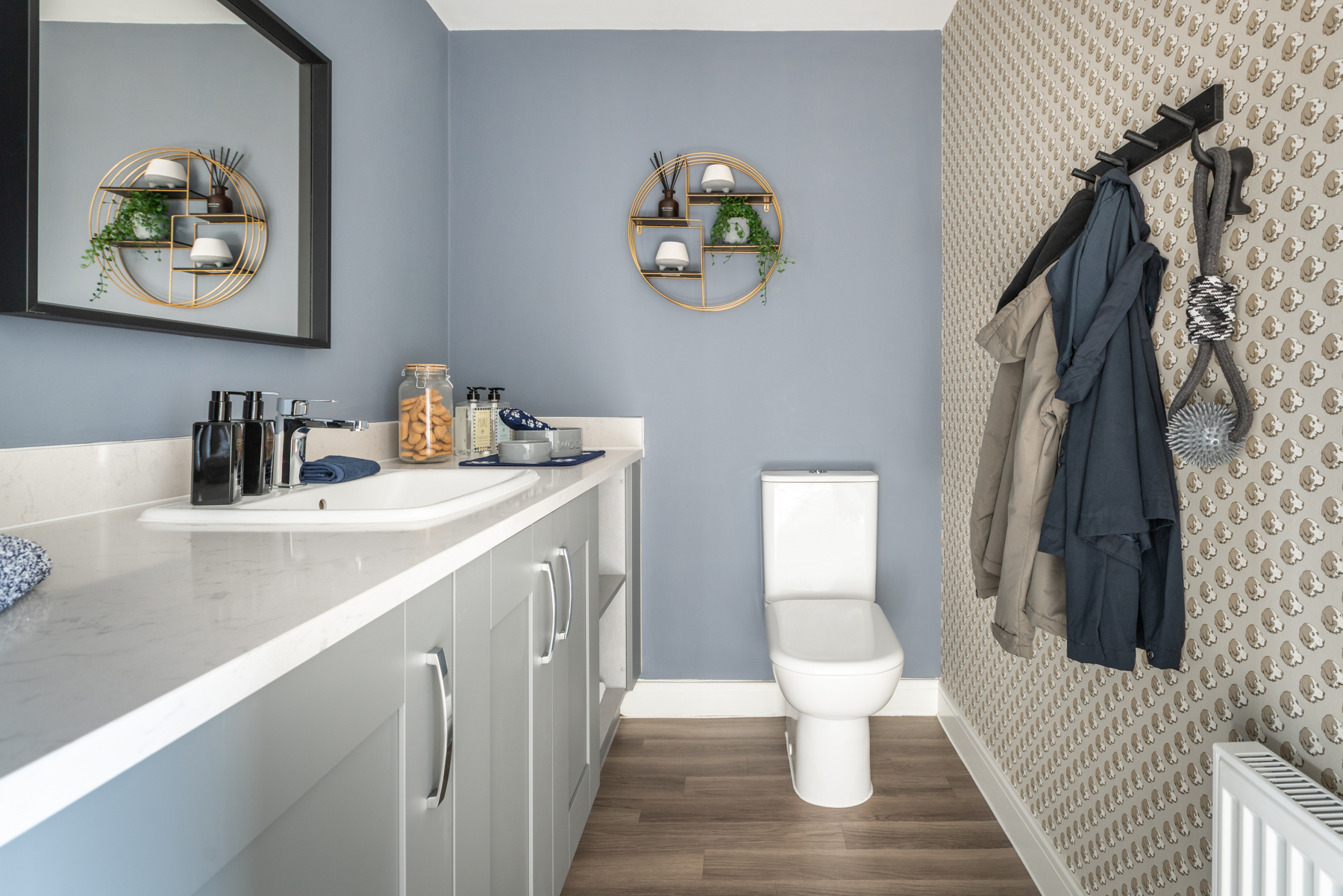 The downstairs cloakroom doubles as a utility