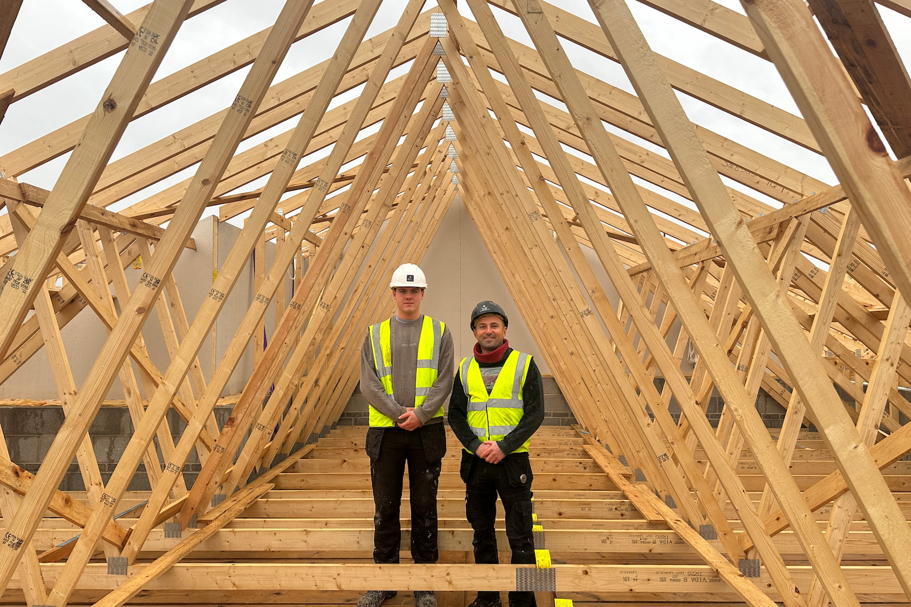 Odhran McGinley (left), now a carpentry apprentice at SJB Contracting and Stefan-Mardarie Spatar, Site Supervisor at SJB Contracting, both working on The Tramworks development