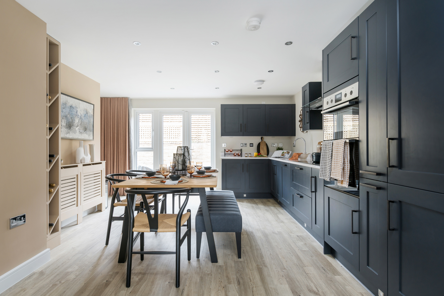 Double doors lead out from the kitchen to the garden