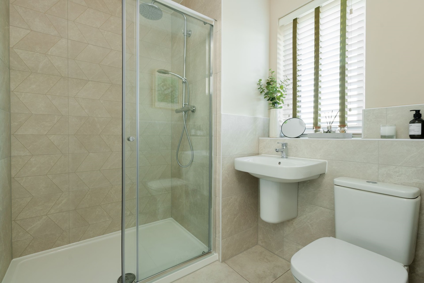 Bedroom 1 benefits from an en suite shower room