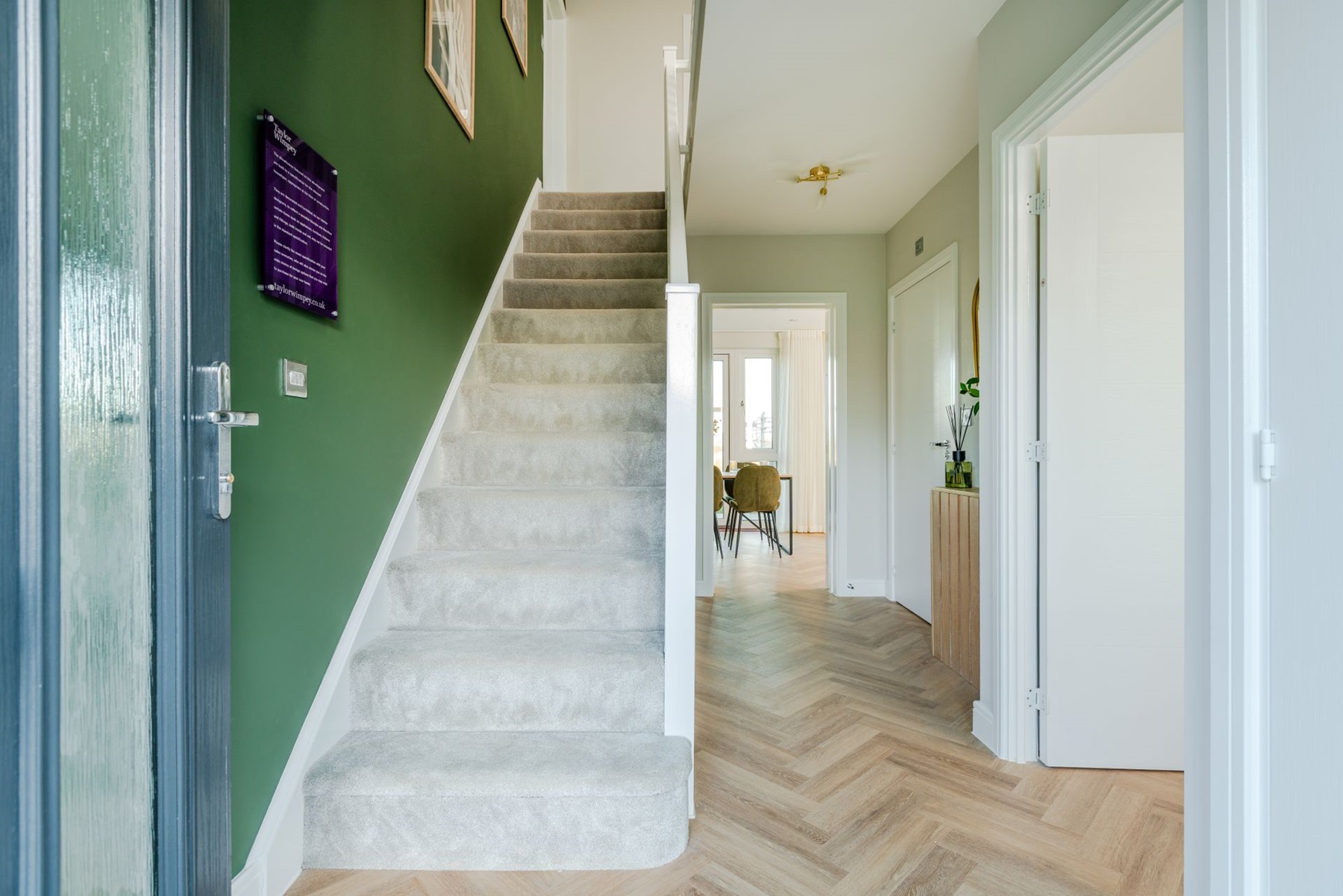 A light and airy hallway welcomes you into this home