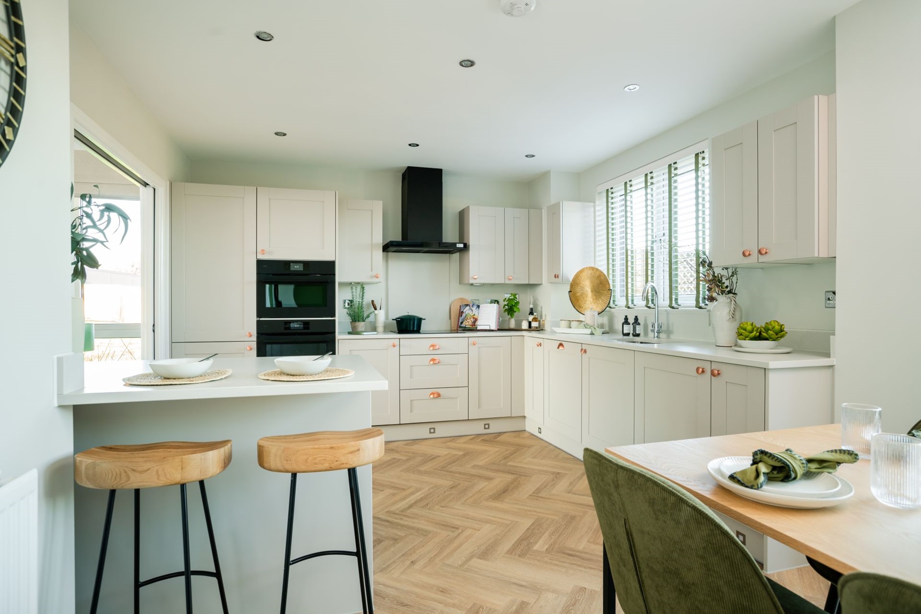 A modern kitchen area with an island counter