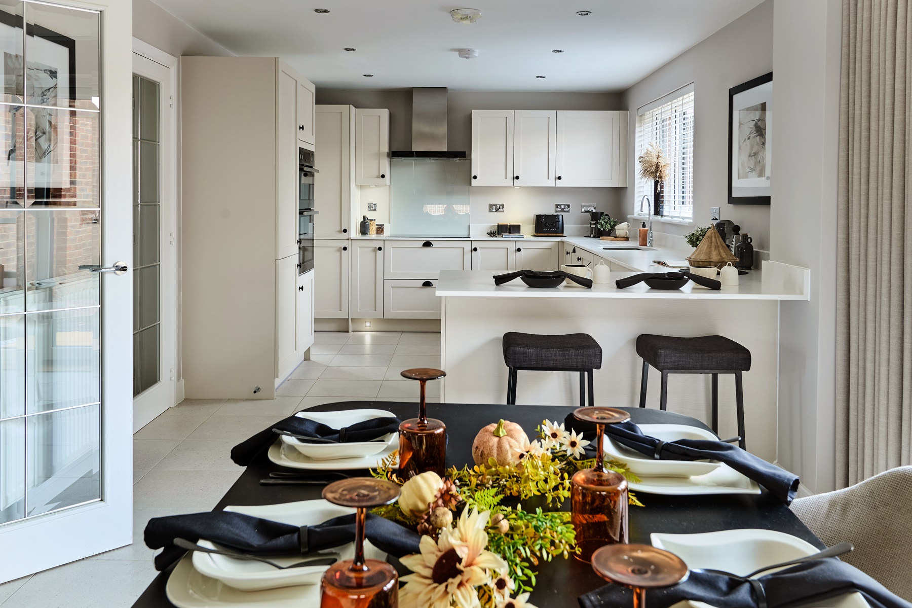 A breakfast bar and space for a dining area creates sociable mealtimes in the Rightford