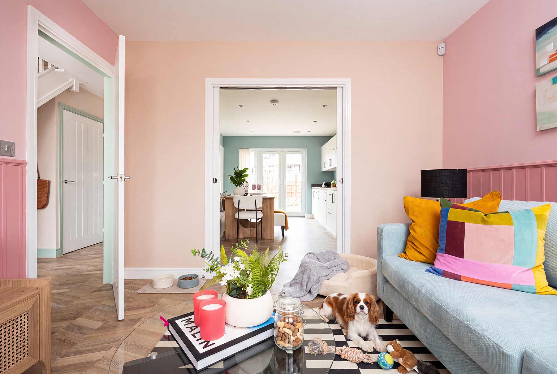 The living room flows seamlessly into the kitchen/dining room