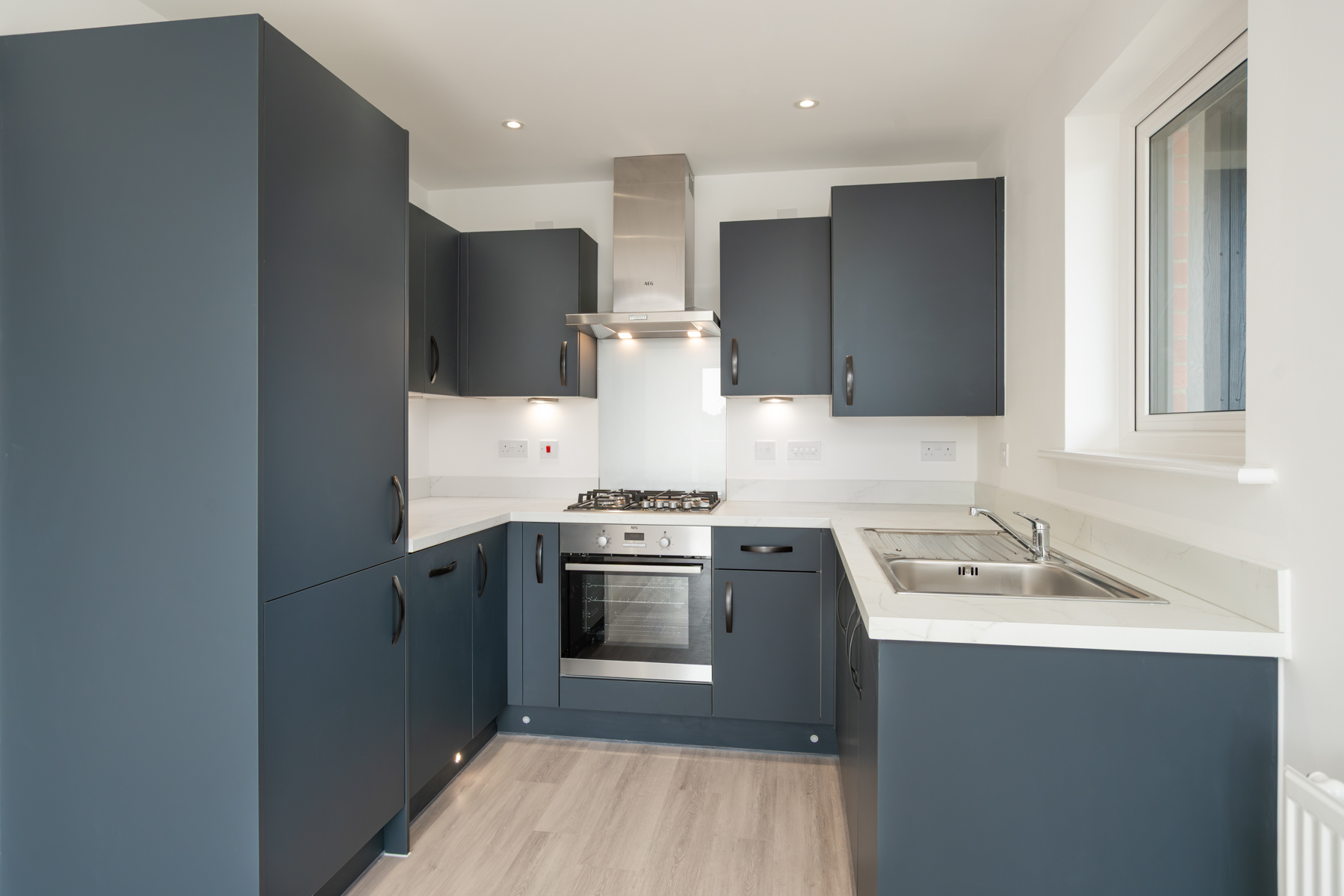 The kitchen comes complete with integrated appliances