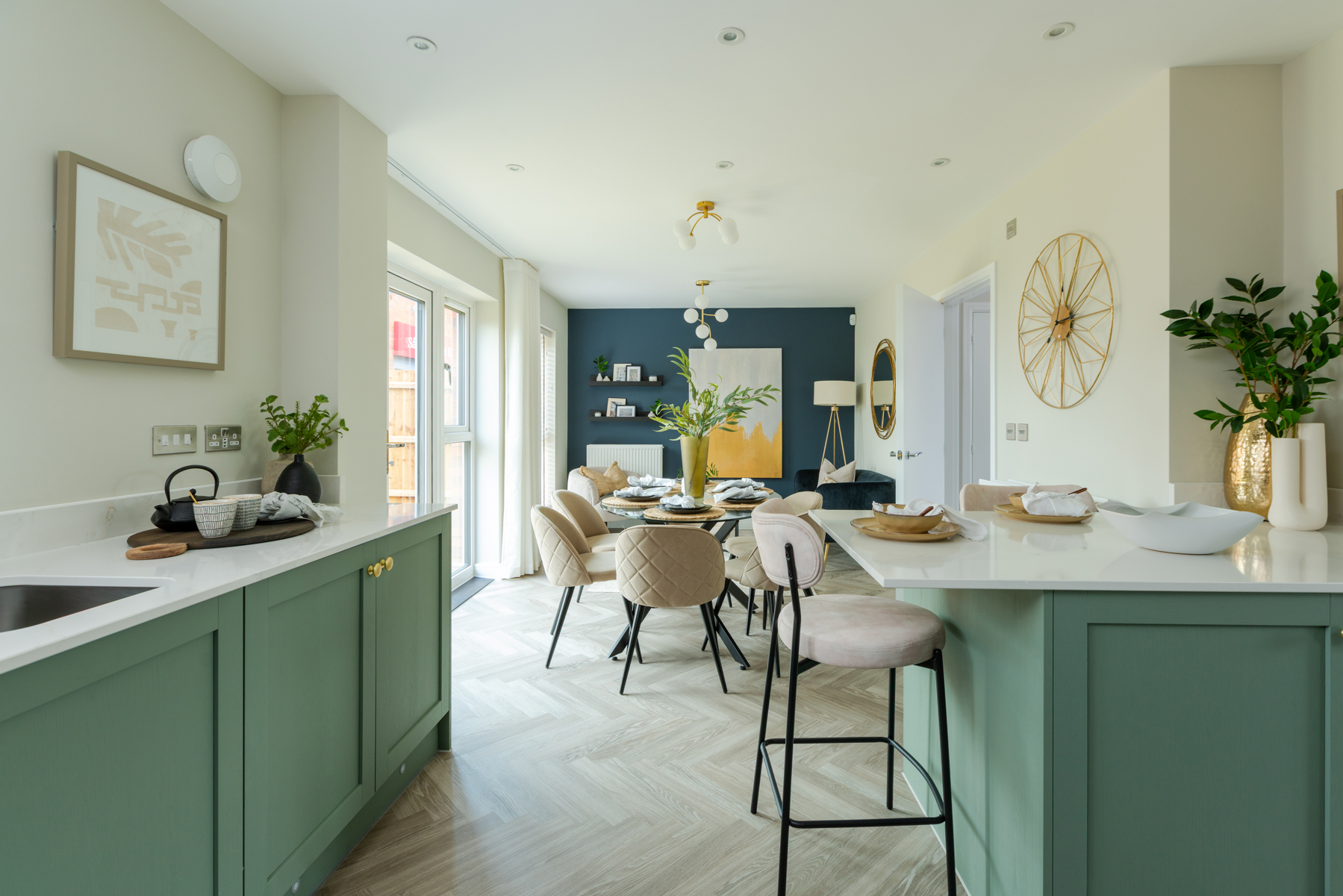 The kitchen flows seamlessly into the living spaces