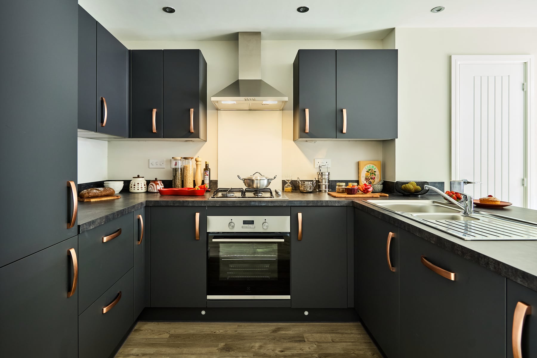 The kitchen is modern with ample storage