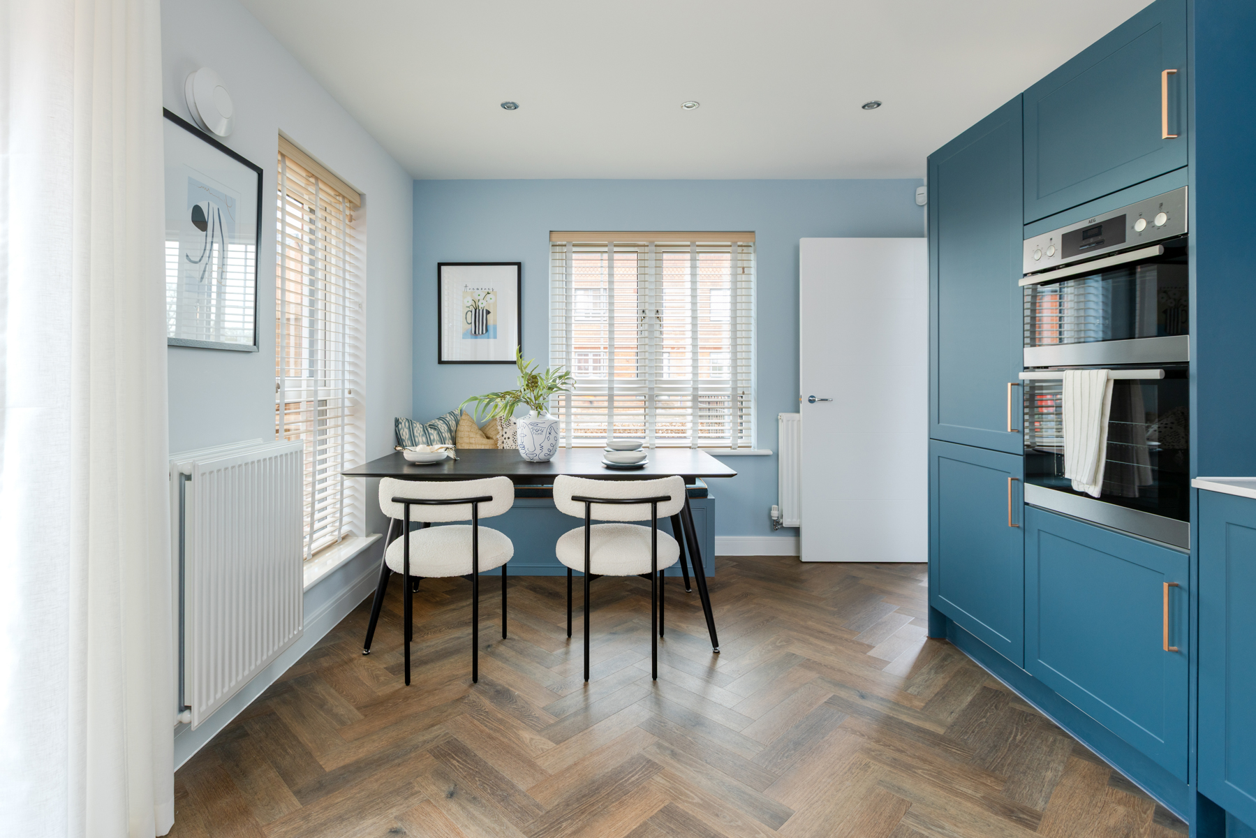 Dual aspect windows flood the dining space with light