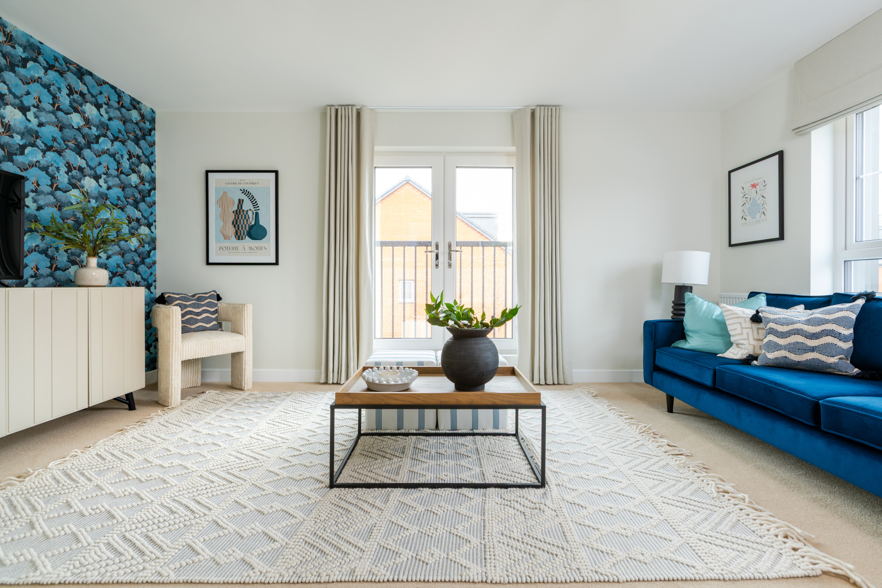 A bright and airy living room with Juliette balcony