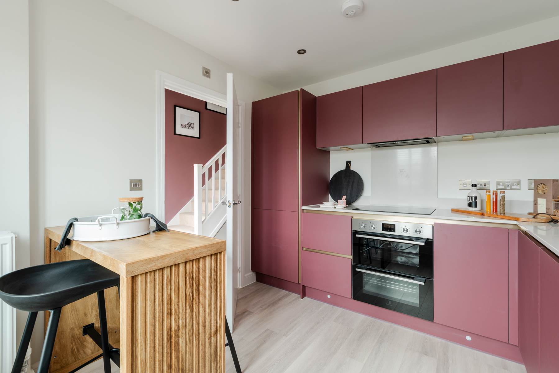 Why not try putting a breakfast bar in the corner?