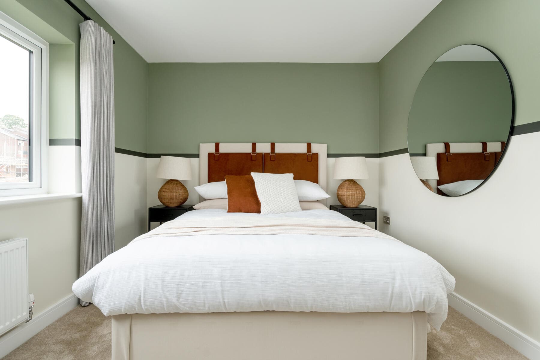 Bed with mirror and bedside tables 