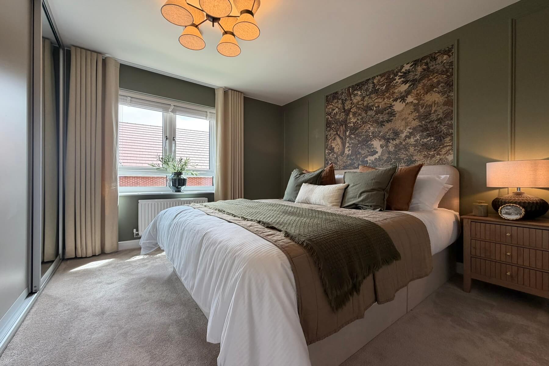 Main bedroom with double bed and fitted storage