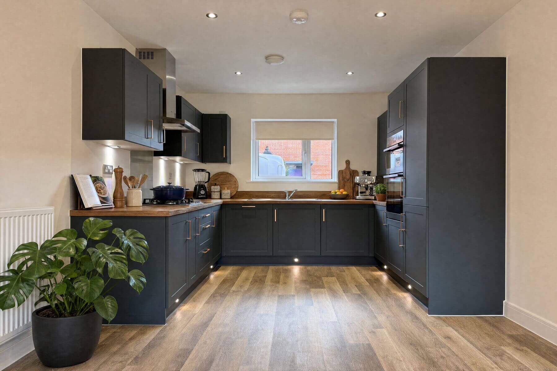 Modern fitted kitchen with sleek cabinetry and integrated appliances