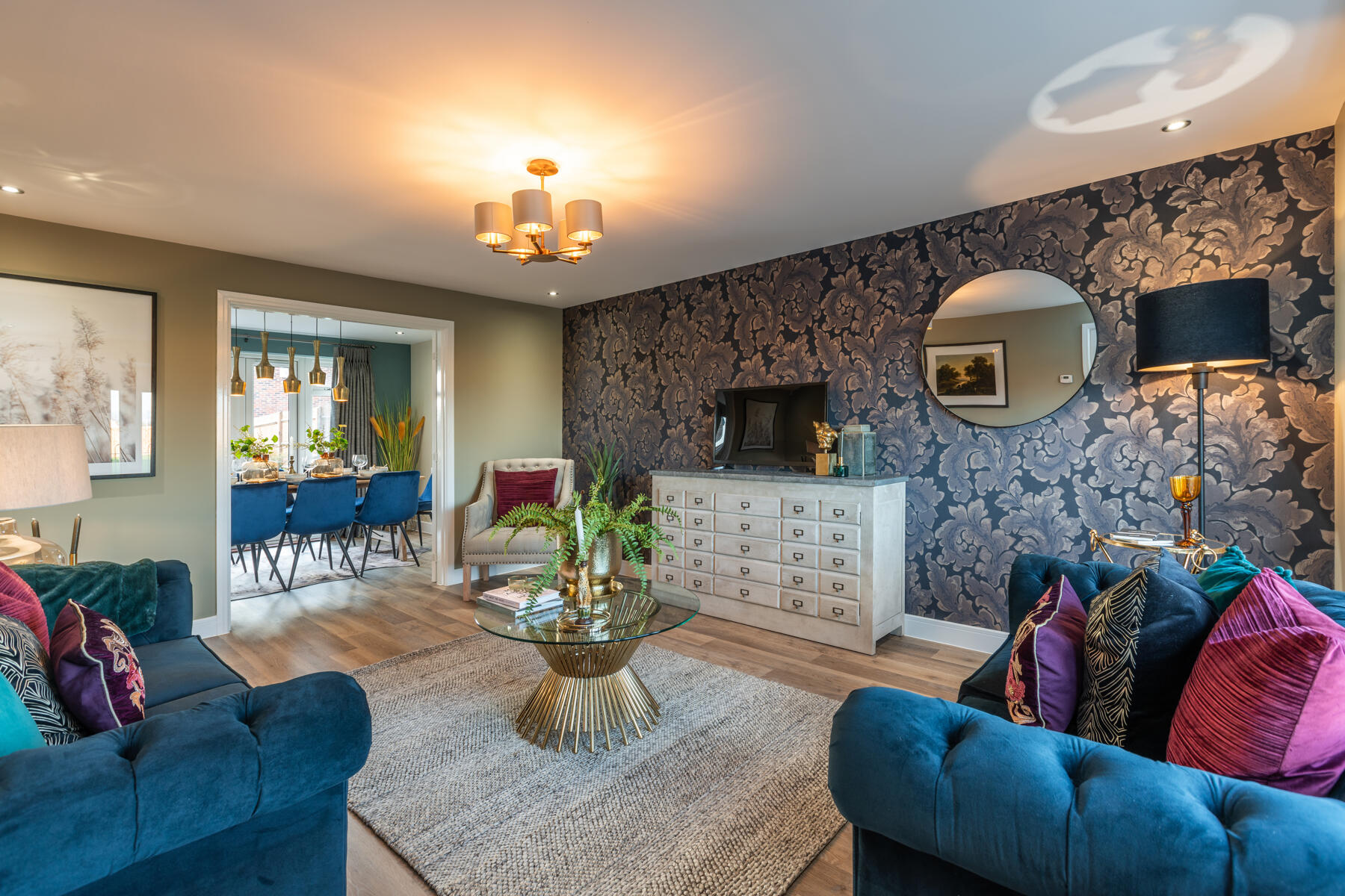 Living room with doors through to dining/kitchen area