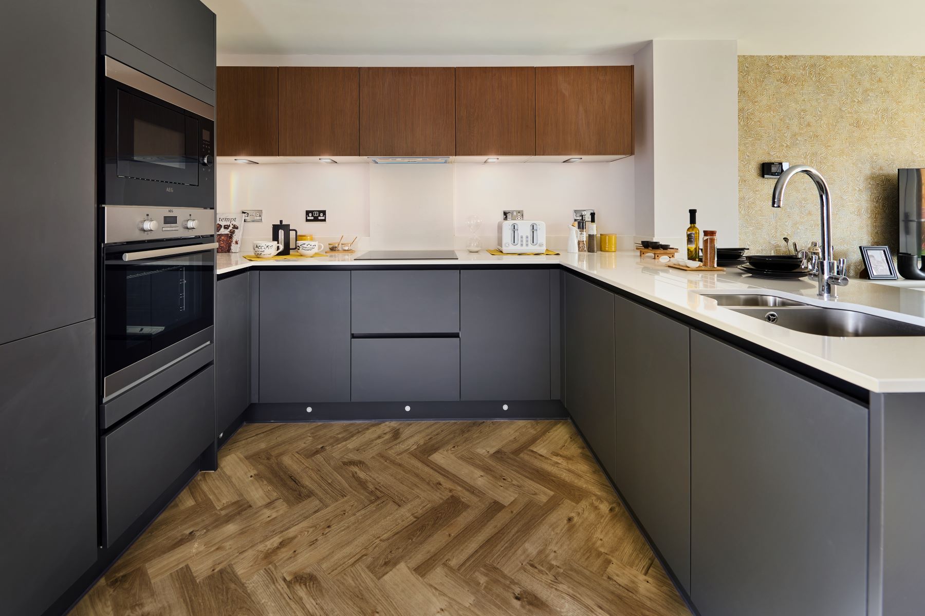 The kitchen features a useful breakfast bar
