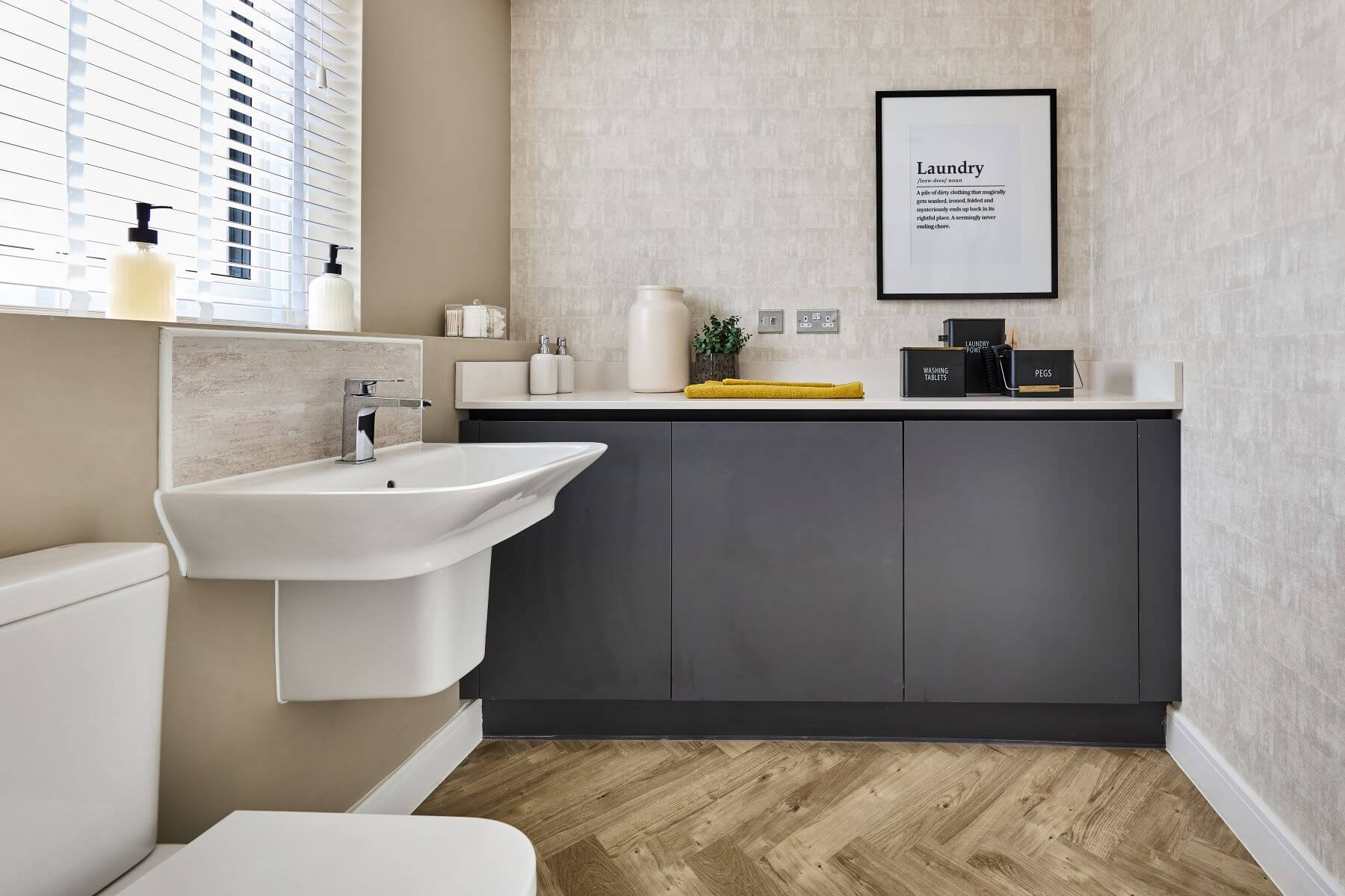 The downstairs WC doubles as a handy utility room