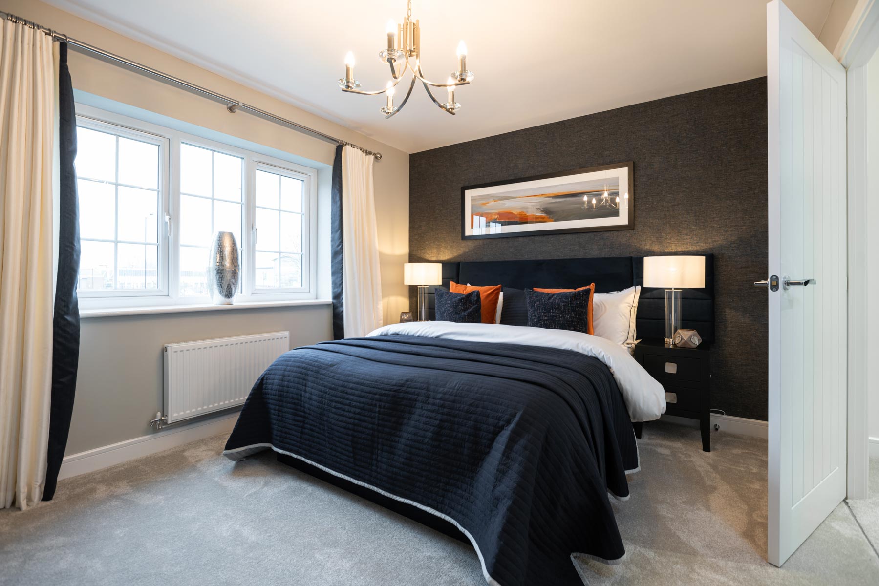 The main bedroom features large windows